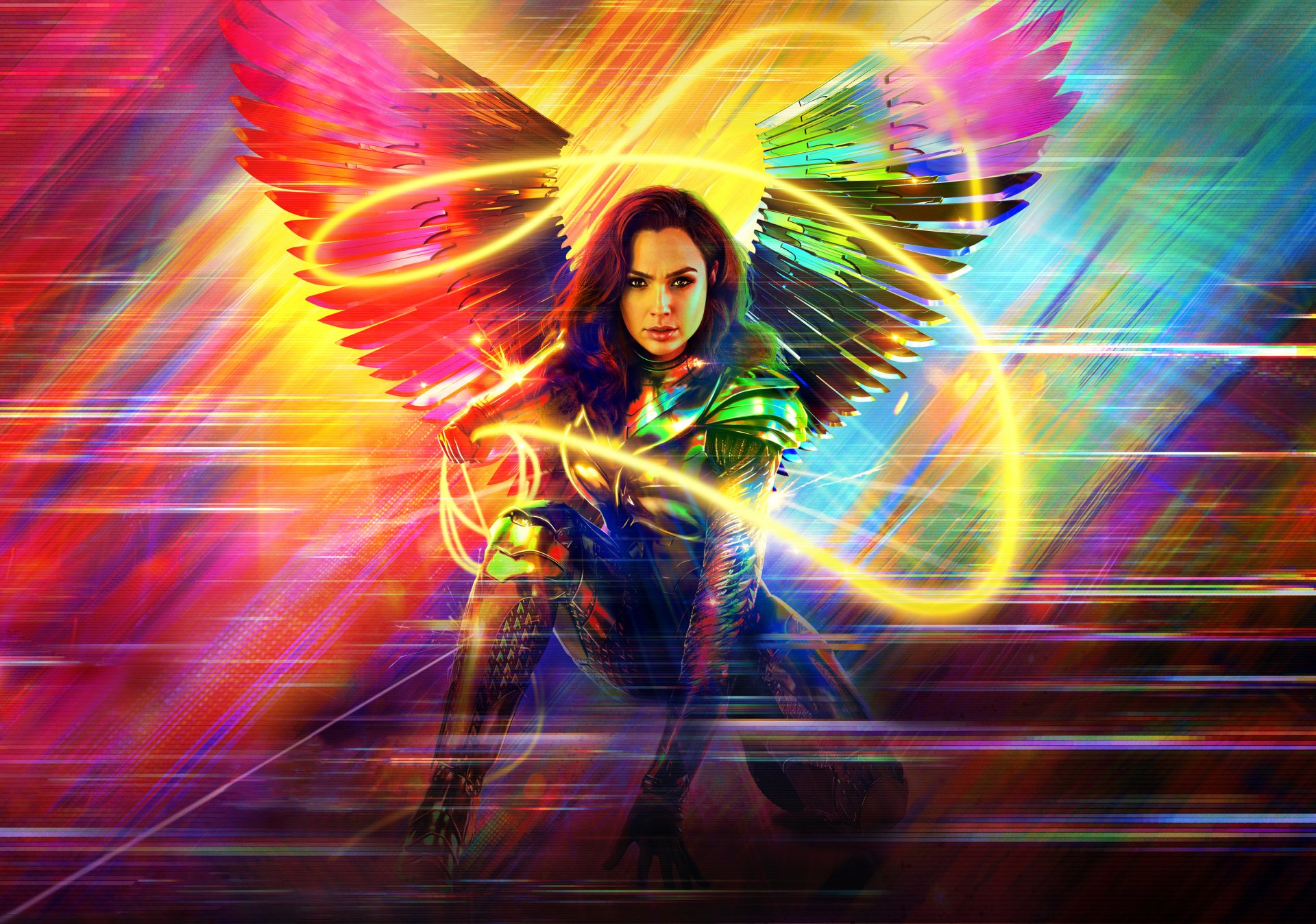 Gal Gadot as Wonder Woman in Wonder Woman 1984, wielding the glowing Lasso of Truth with vibrant, colorful wings unfurled behind her.