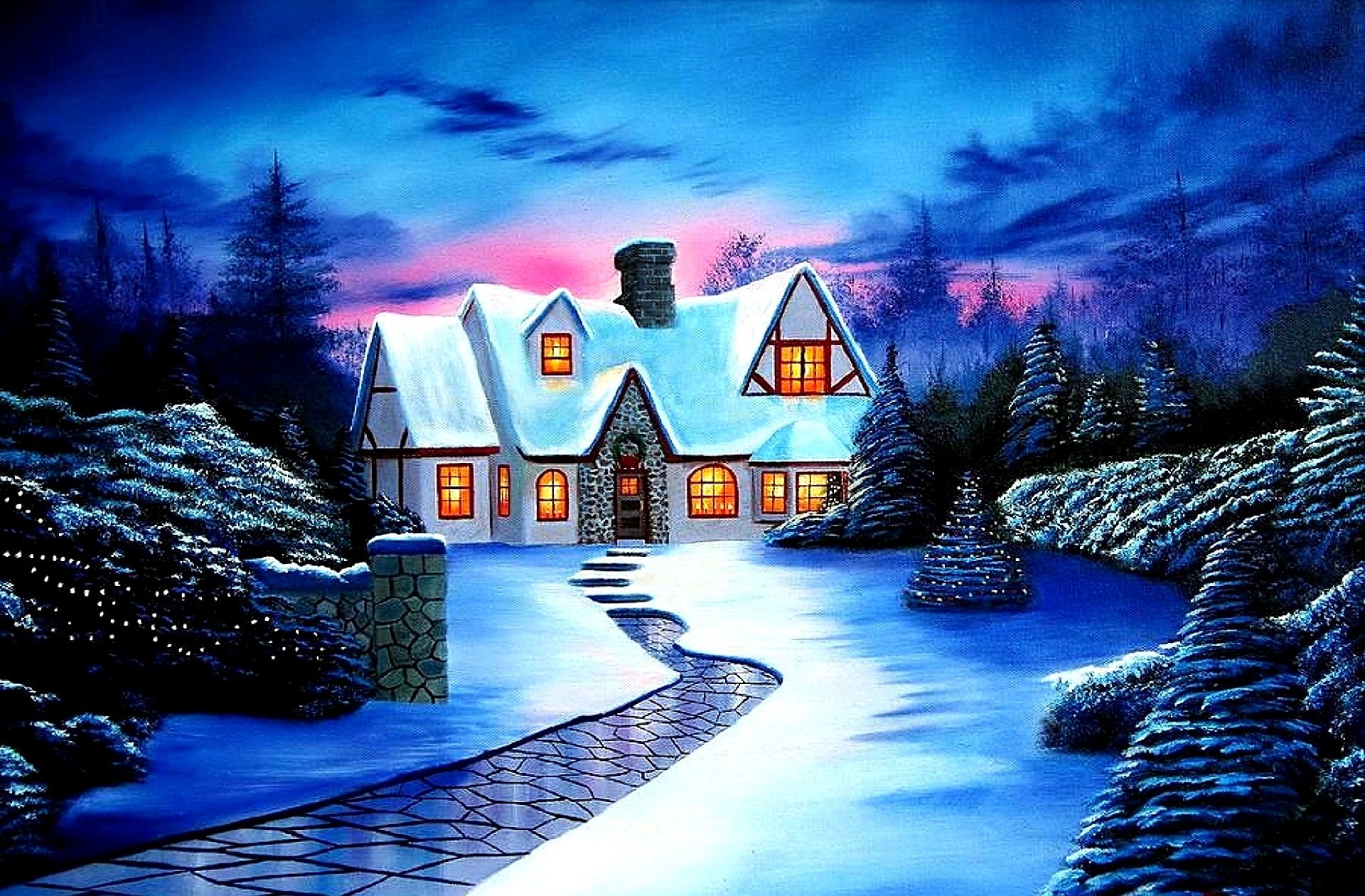 Snow-covered house at sunset with glowing windows, a wreath on the door, a decorated Christmas tree outside and a winding path through winter trees and fresh snow.