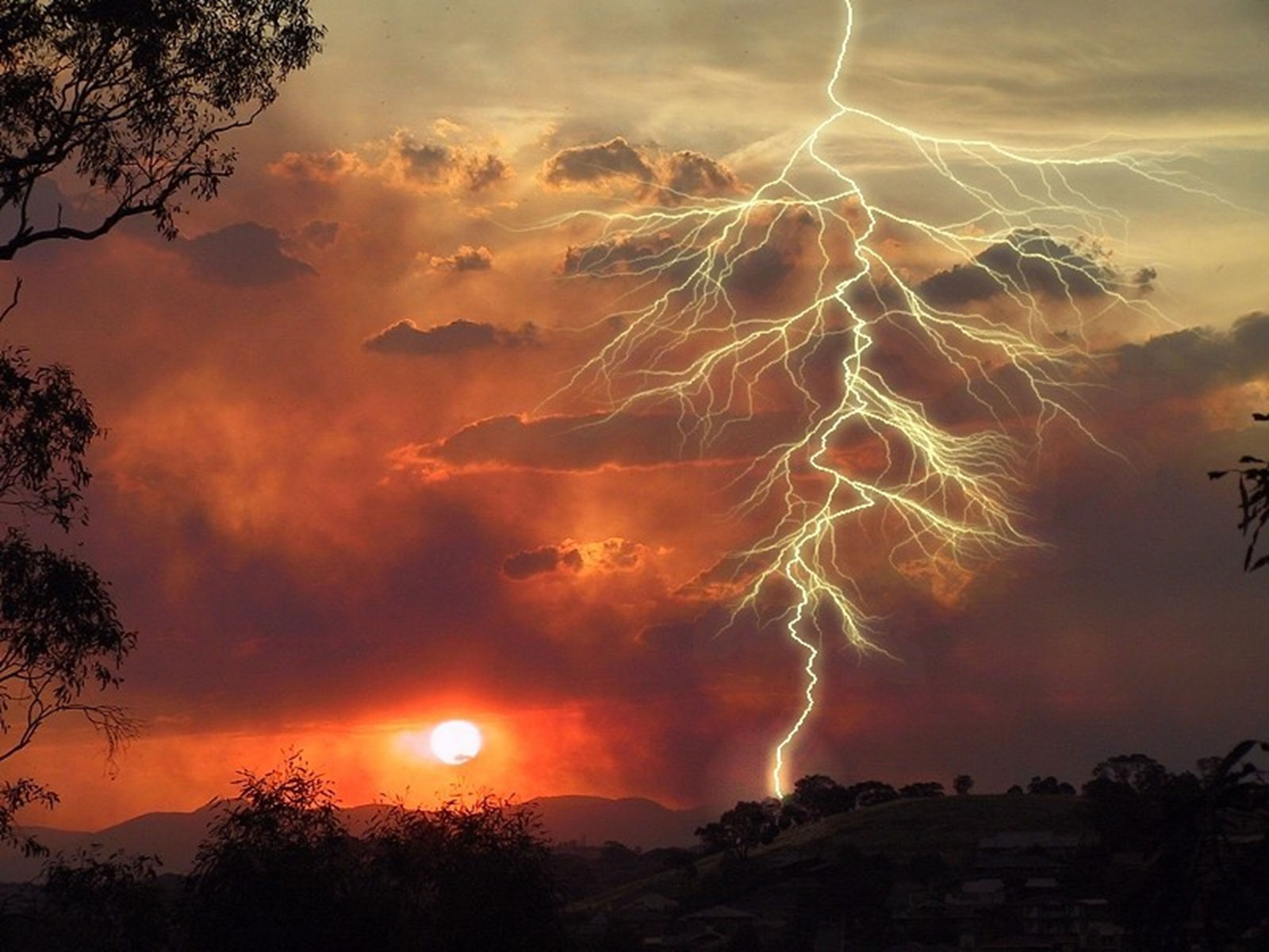 A lightning strike or lightning bolt is an electric discharge between the atmosphere and the ground.