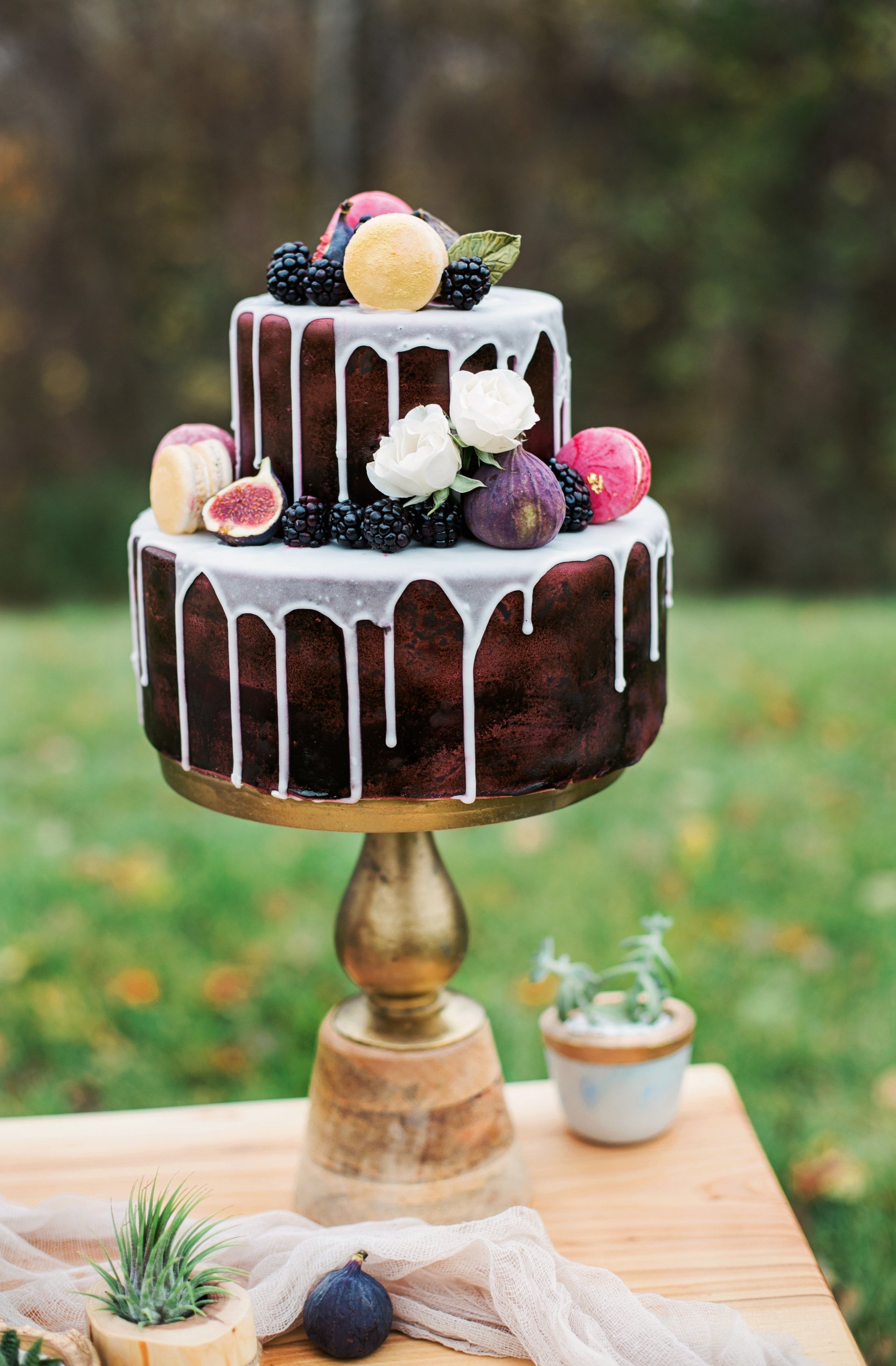  Two Tier Cake Decorated With Flowers And Fruits