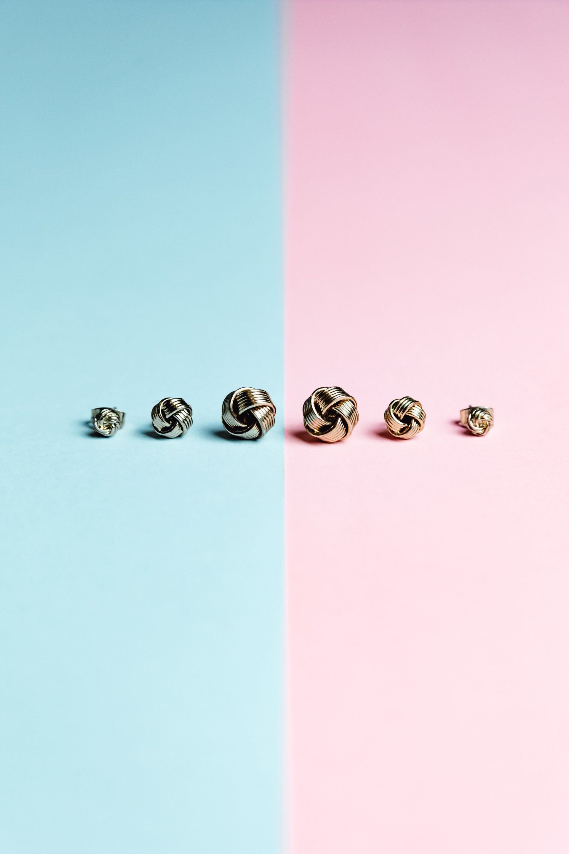  Blue And Pink Background With Earrings In A Line