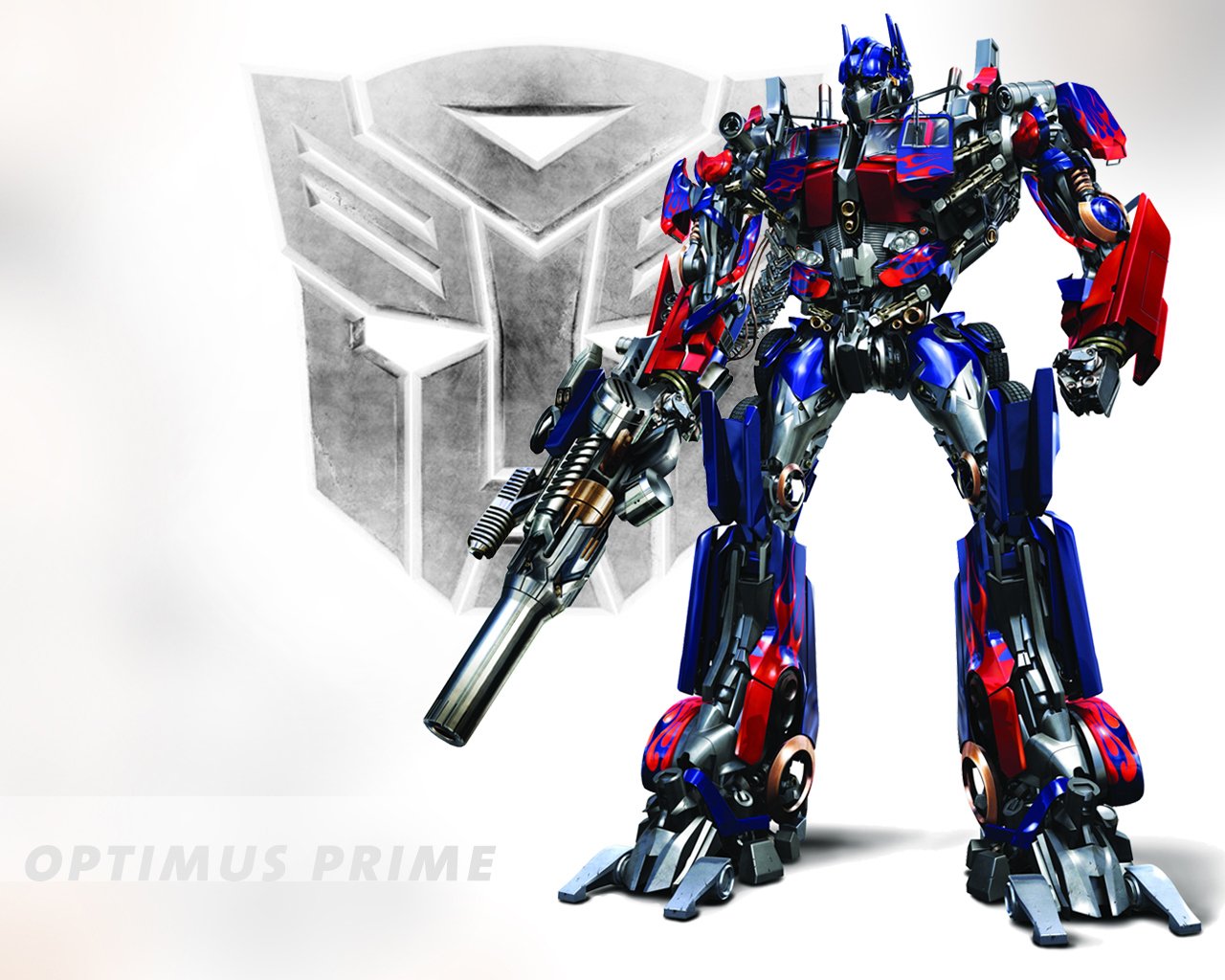 A dynamic image of Optimus Prime from the Transformers movie, showcasing his iconic blue and red exterior along with a prominent Autobot symbol in the background.