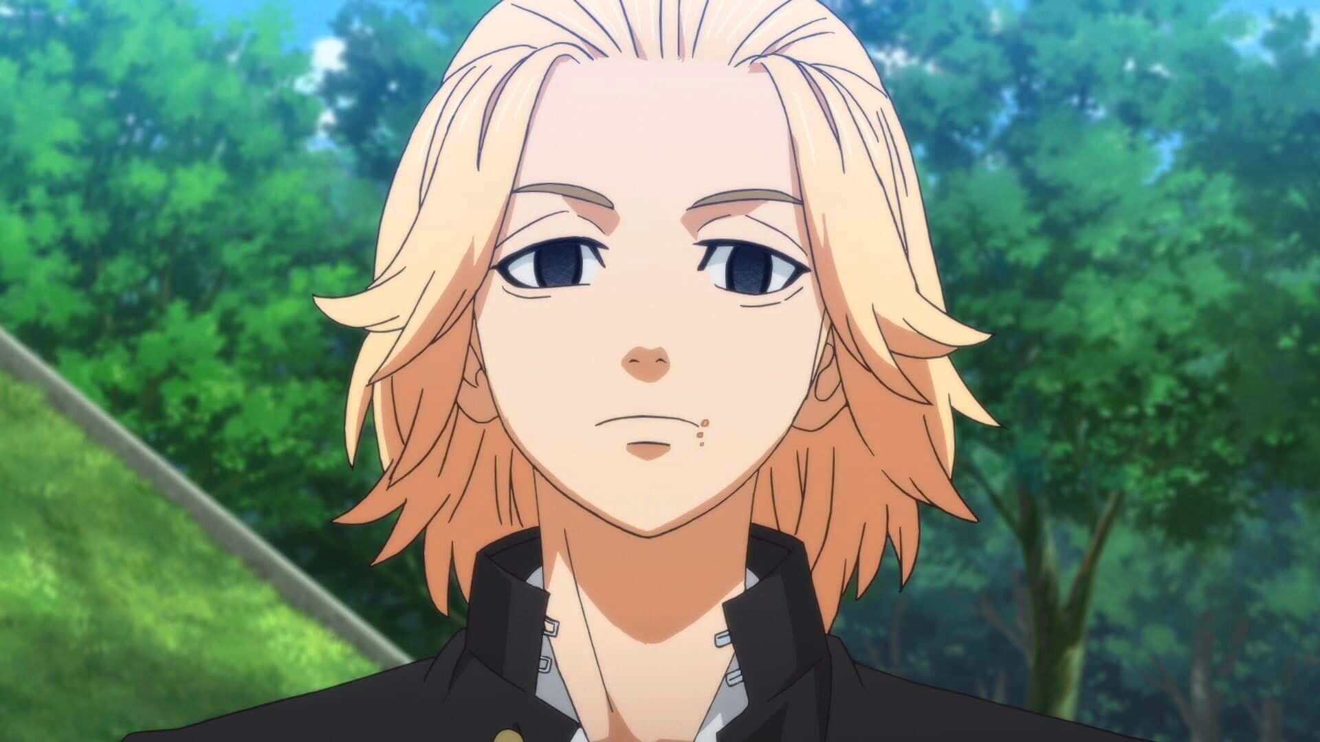 Mikey Manjiro Sano from the anime Tokyo Revengers stands outdoors with a calm expression, surrounded by greenery.