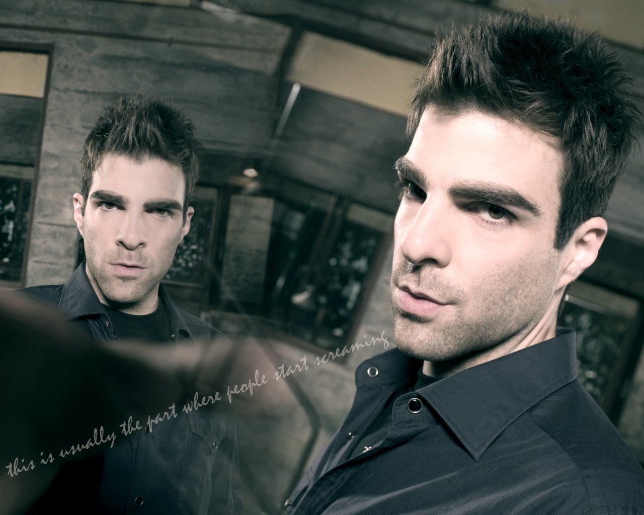 A striking image from the TV show Heroes, featuring a confident character gazing intensely at the viewer, set against a blurred background.