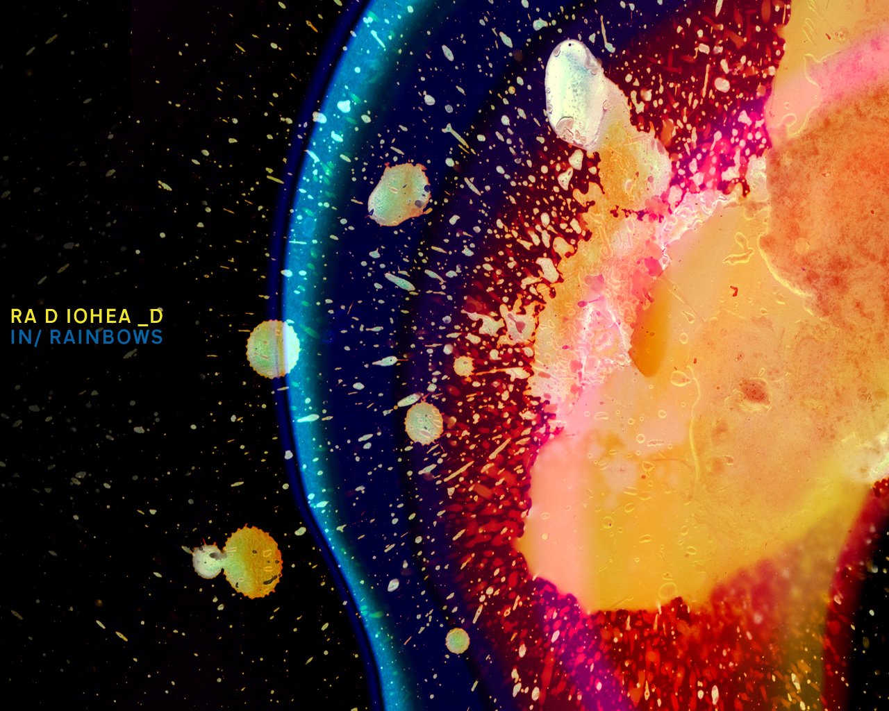 An abstract, colorful design featuring vibrant splashes of paint, representing the album In Rainbows by Radiohead. The artwork exudes a dynamic, artistic vibe.