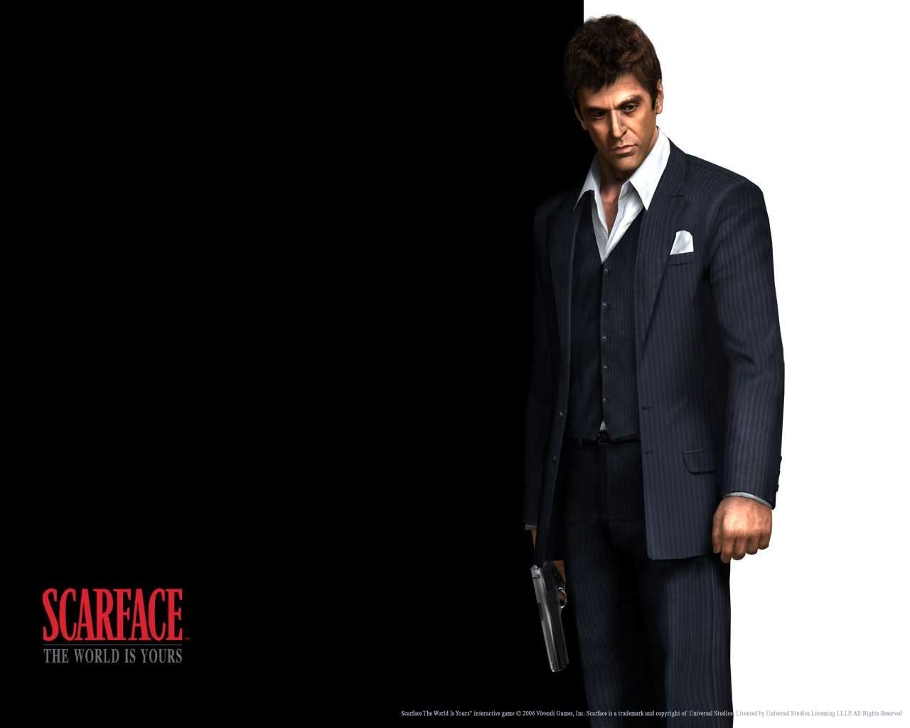 Image of a sharply dressed man in a dark suit from the video game Scarface: The World Is Yours, standing against a black background with the game title in red text.