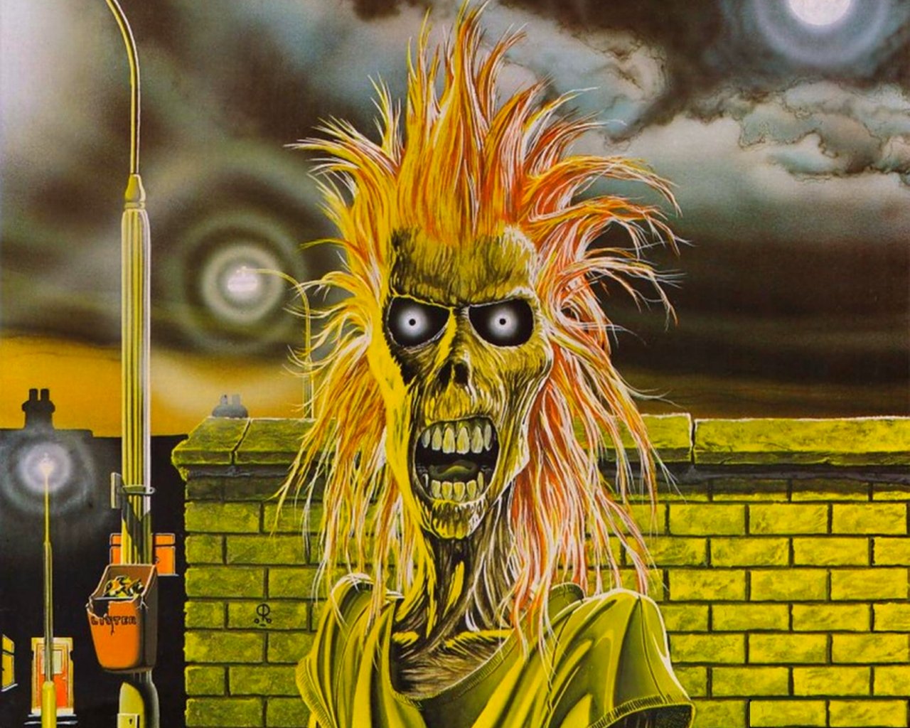 A striking illustration of Iron Maiden's iconic mascot, featuring a skeletal figure with wild orange hair set against a moody, atmospheric backdrop.