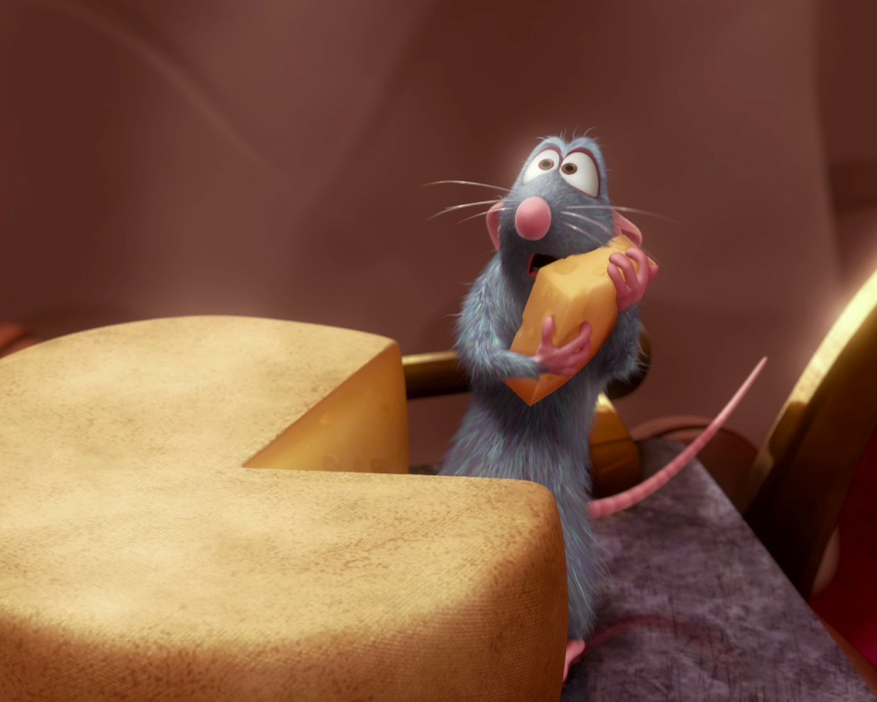 A small blue-grey rat holds a piece of cheese, looking pleased, in a scene inspired by the movie Ratatouille. A large cheese wheel is nearby, set against a blurred background.