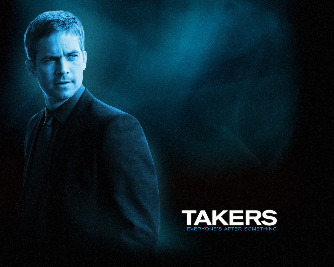 Promotional image for the movie Takers featuring a man in a dark suit against a smoky blue background.