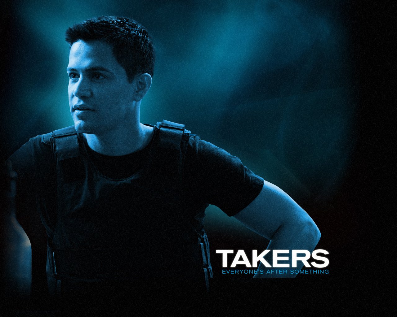 Promotional image for the movie Takers, featuring a man in a tactical vest against a dark, blue-toned background with the tagline Everyone's after something.