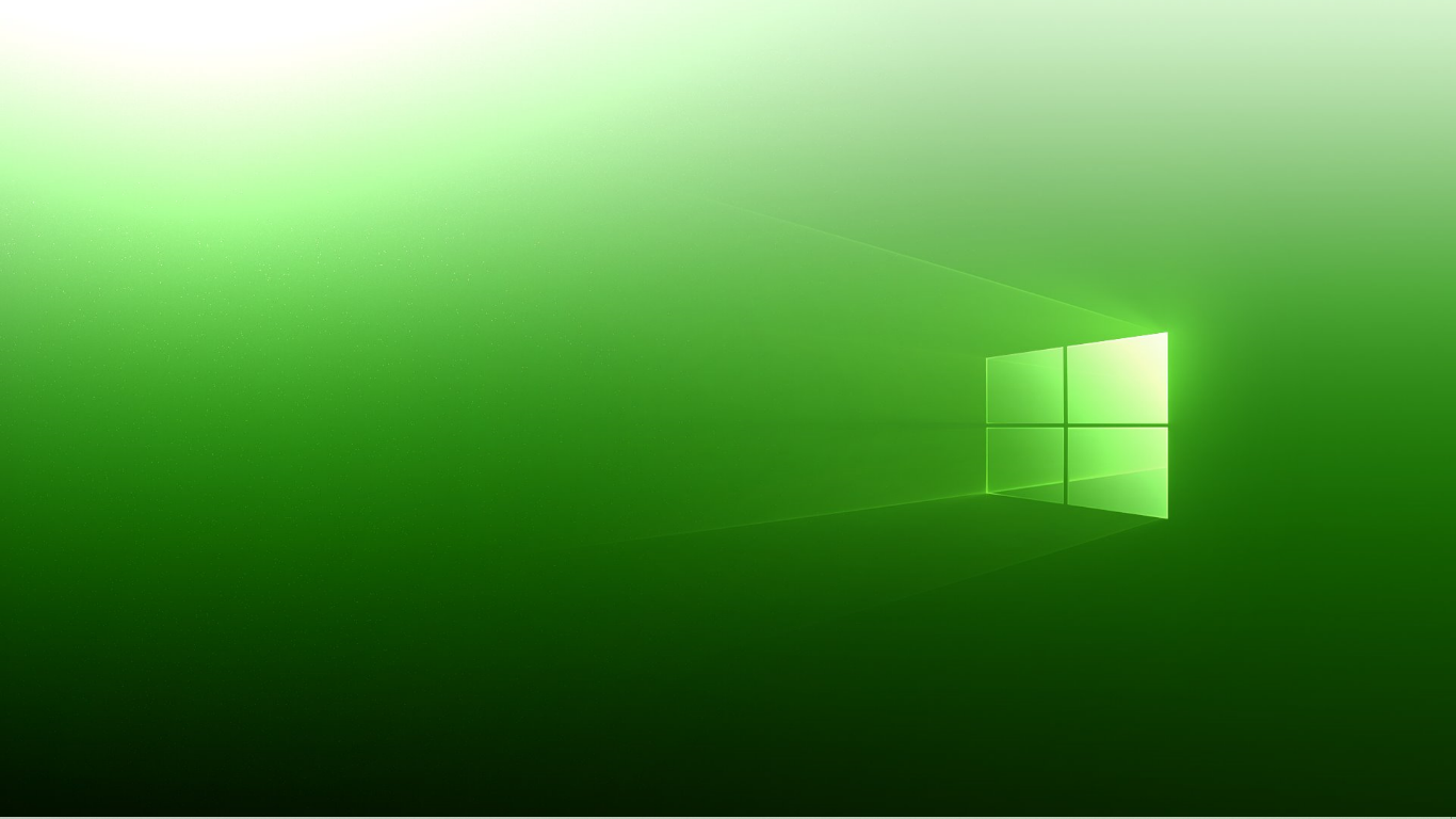 Green gradient technology wallpaper featuring a glowing Windows logo on the right, with light rays and a modern minimalist design.