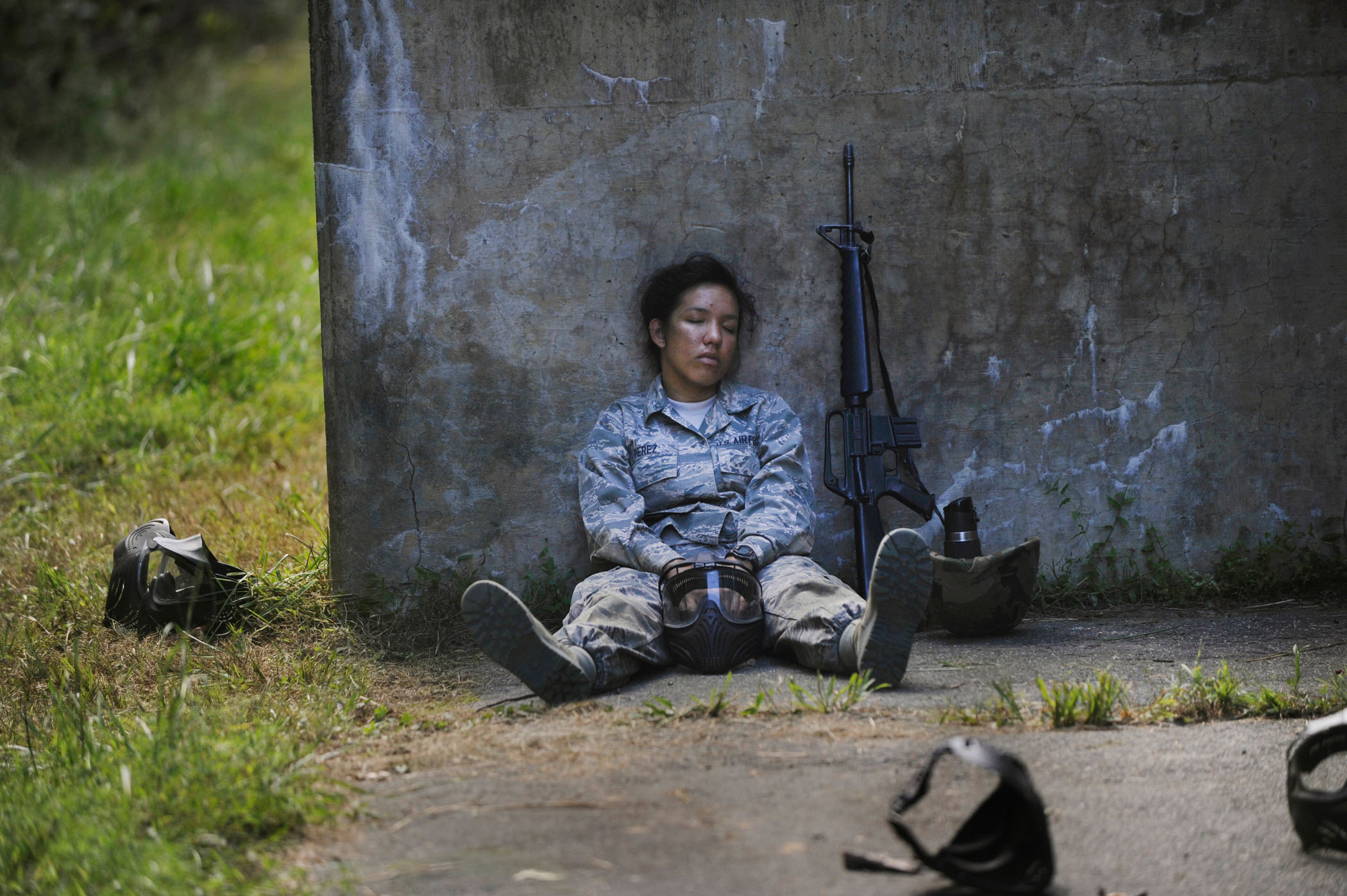 Airman Basic Rebecca Perez takes a break from patrol during a field training exercise