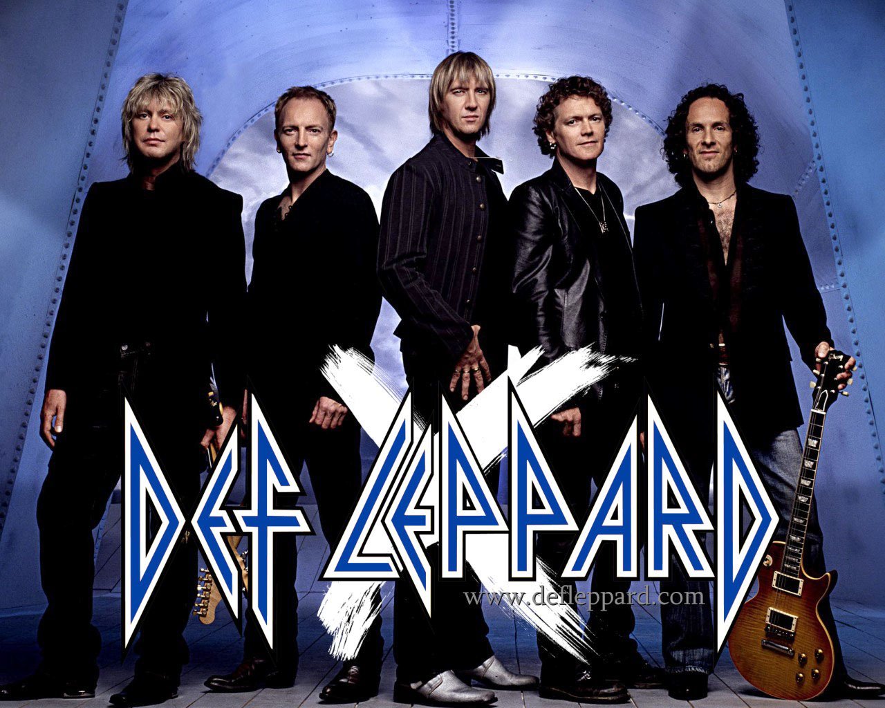 The image features the rock band Def Leppard posing together with a guitar, set against a metallic blue background and their logo prominently displayed.
