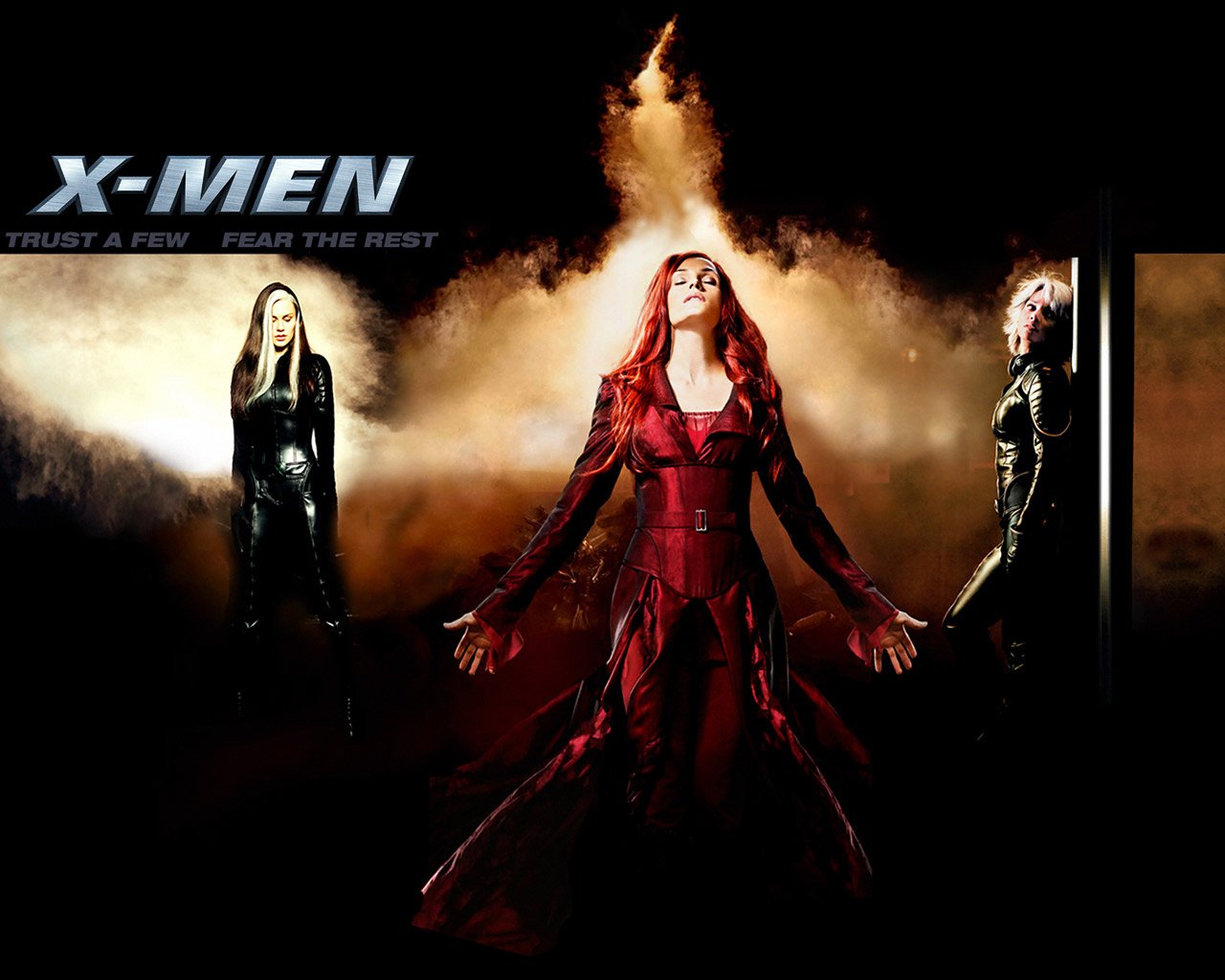 A dramatic scene from X-Men: The Last Stand features Phoenix Jean Grey in a red outfit, flanked by Storm and Rogue, embodying the intensity of Marvel Comics' mutant heroes.