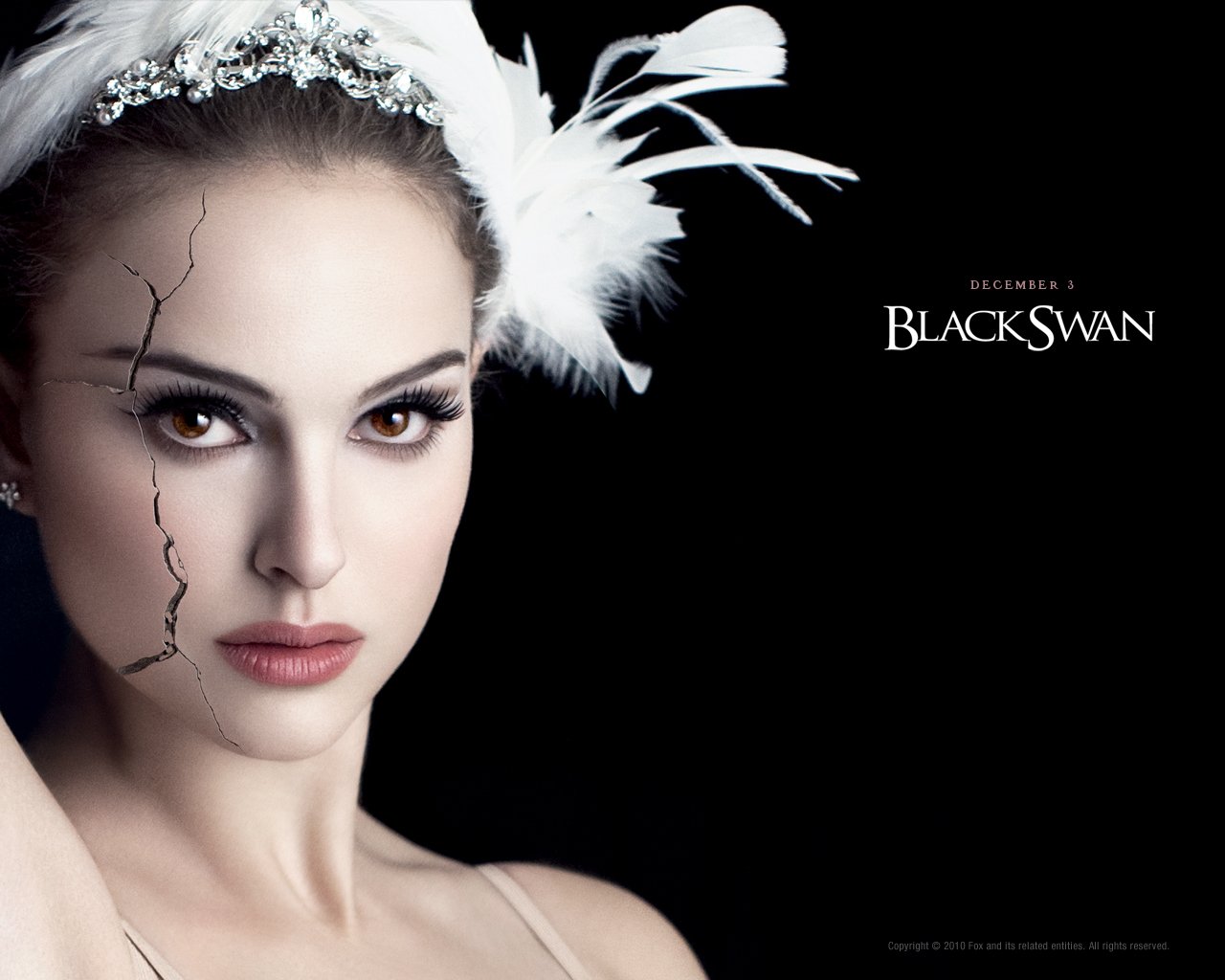 Close-up of Natalie Portman as the Black Swan, featuring her intense gaze, white feathered headpiece, and a cracked facial effect against a dark background with the movie title.