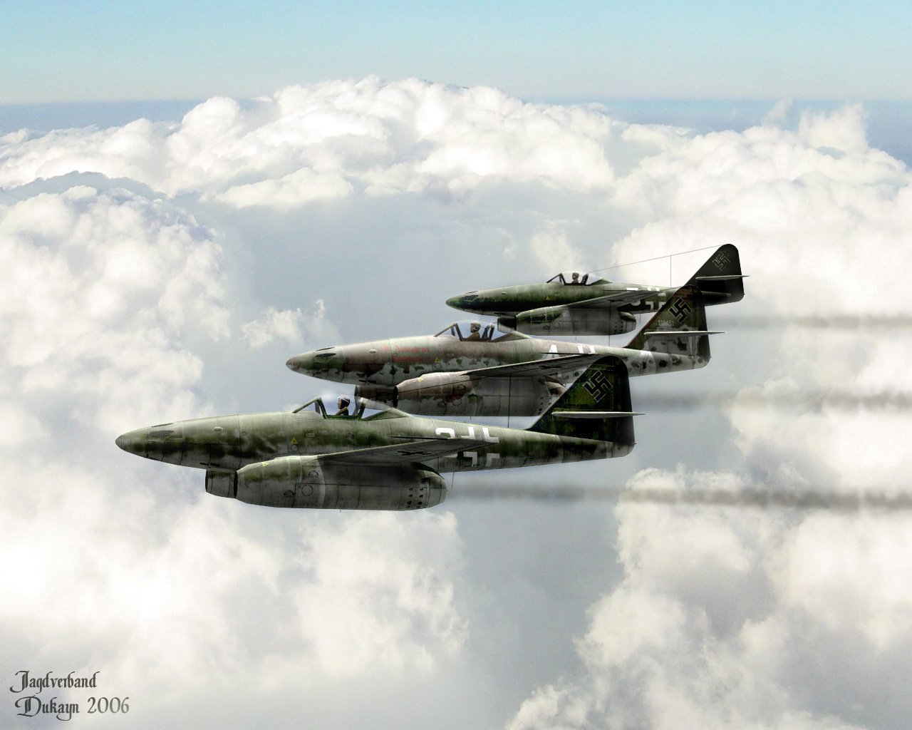 Three military aircraft fly in formation above a sea of clouds, leaving trails of smoke against a clear blue sky.