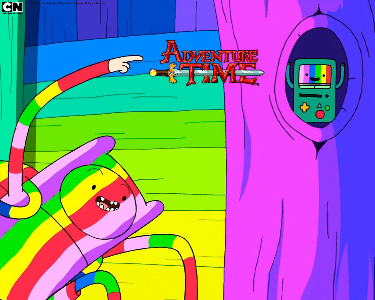 A colorful character from Adventure Time points excitedly at a game console embedded in a vibrant tree, with the show's title prominently displayed in the background.