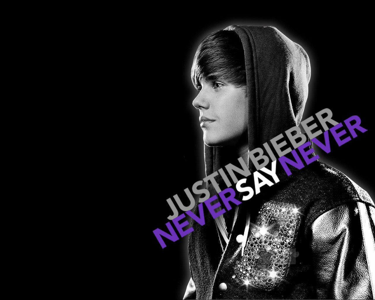 A black-and-white image of Justin Bieber, wearing a hooded jacket, with the text NEVER SAY NEVER in bold purple letters, reflecting his music career and optimistic message.