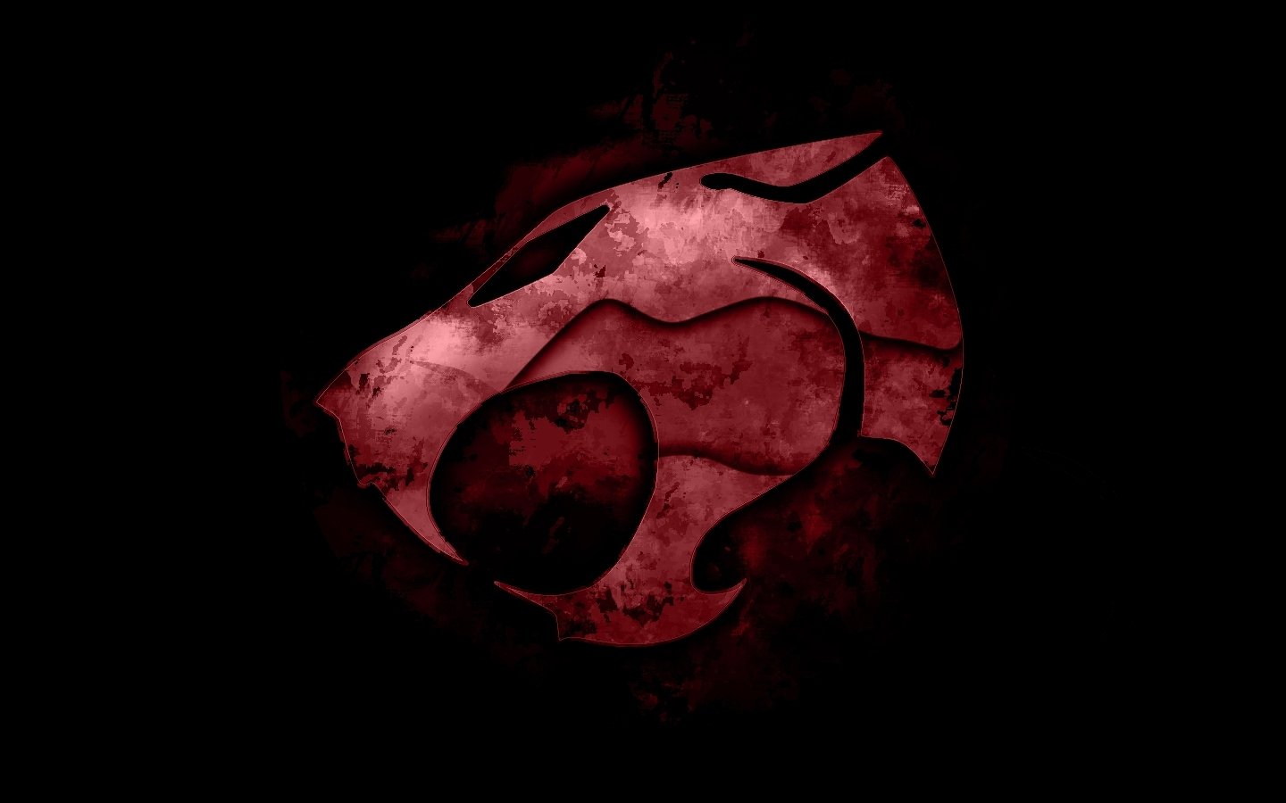 The iconic red Thundercats emblem from the 1985 TV show glows against a dark, smoky background.