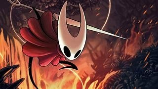 Hornet from the video game Hollow Knight: Silksong lunges with her needle and thread against a glowing, fiery cavern backdrop.