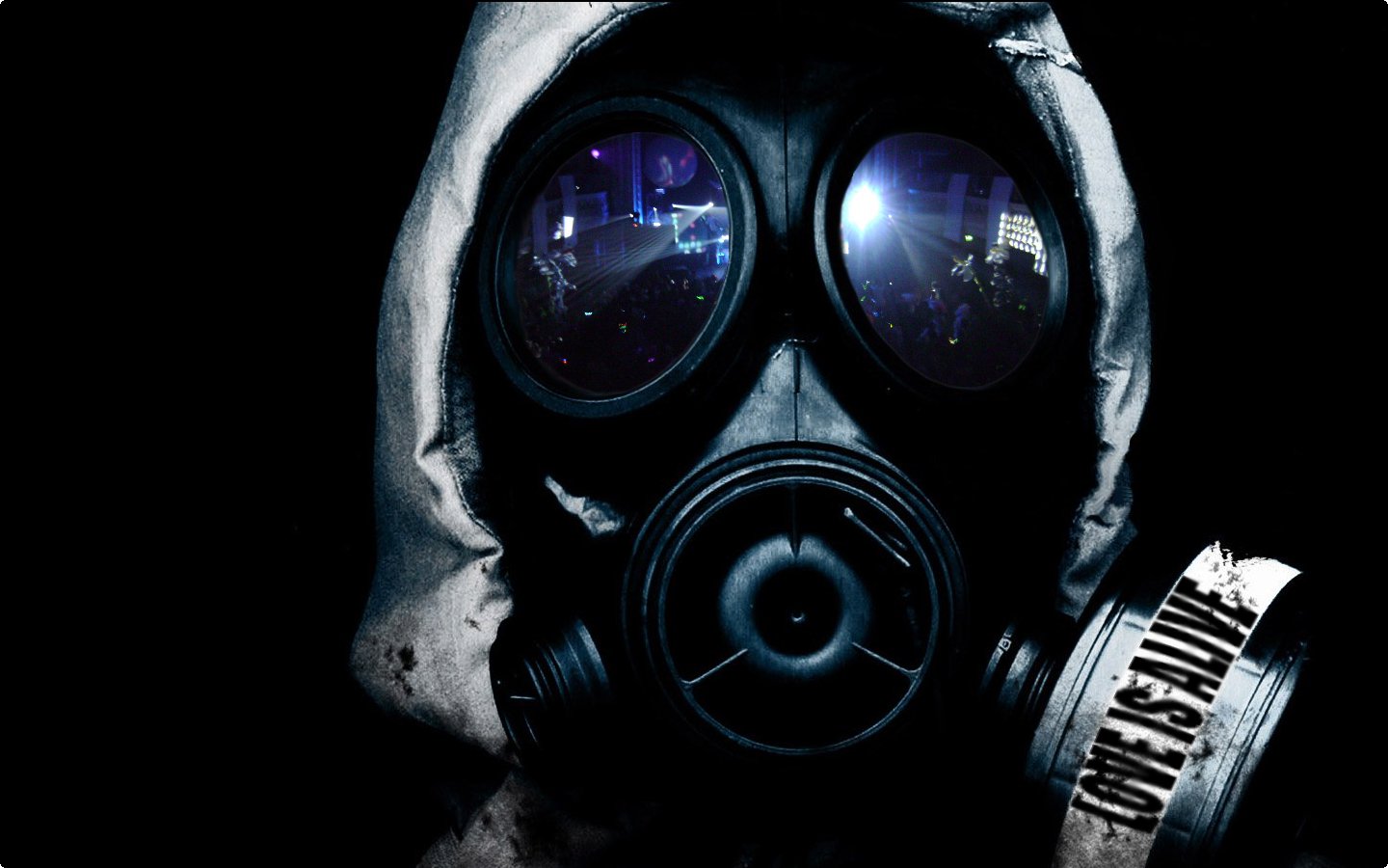 A close-up of a gas mask set against a dark background, with reflections in the lenses and the phrase Love is Pain featured prominently. The image evokes a sense of military readiness.