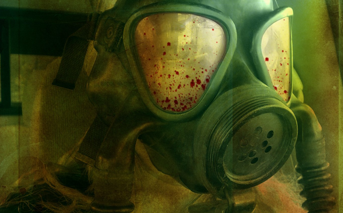 A dark, atmospheric image featuring a gas mask with a slightly blurred background, highlighting the eerie ambiance and hints of red stains on the mask lenses.