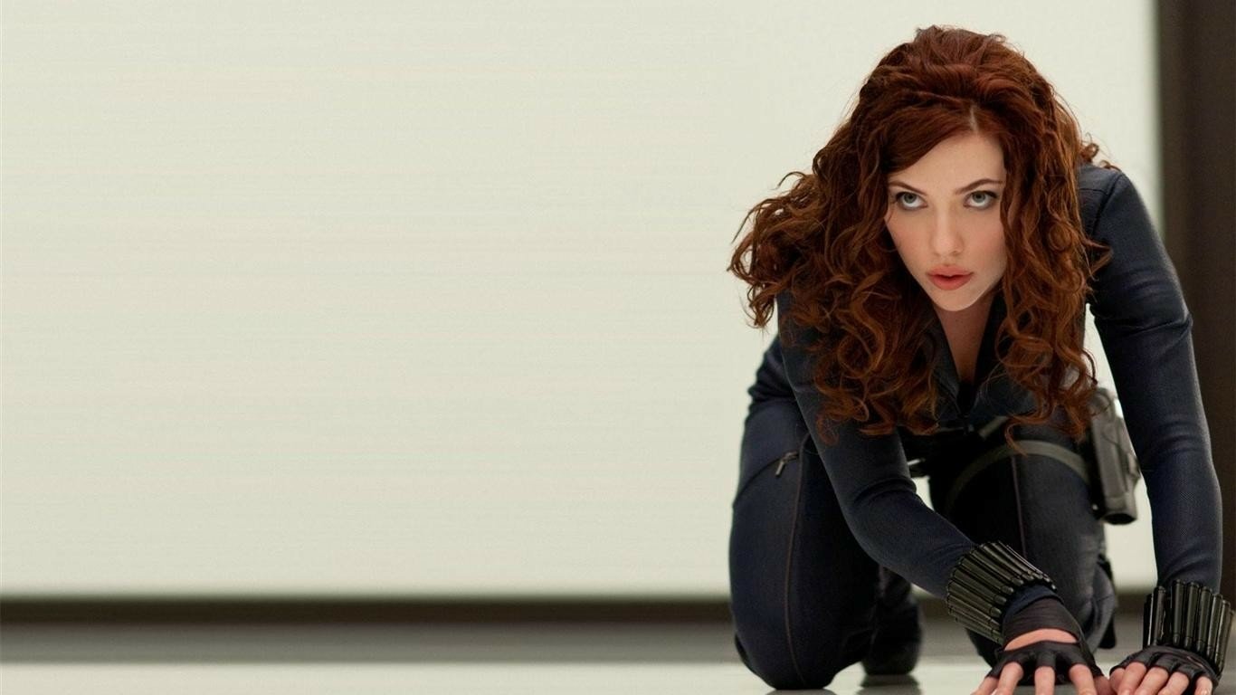 A poised Black Widow from the movie Iron Man 2, she is depicted in a dynamic crouching position, showcasing her fierce attitude and readiness for action.