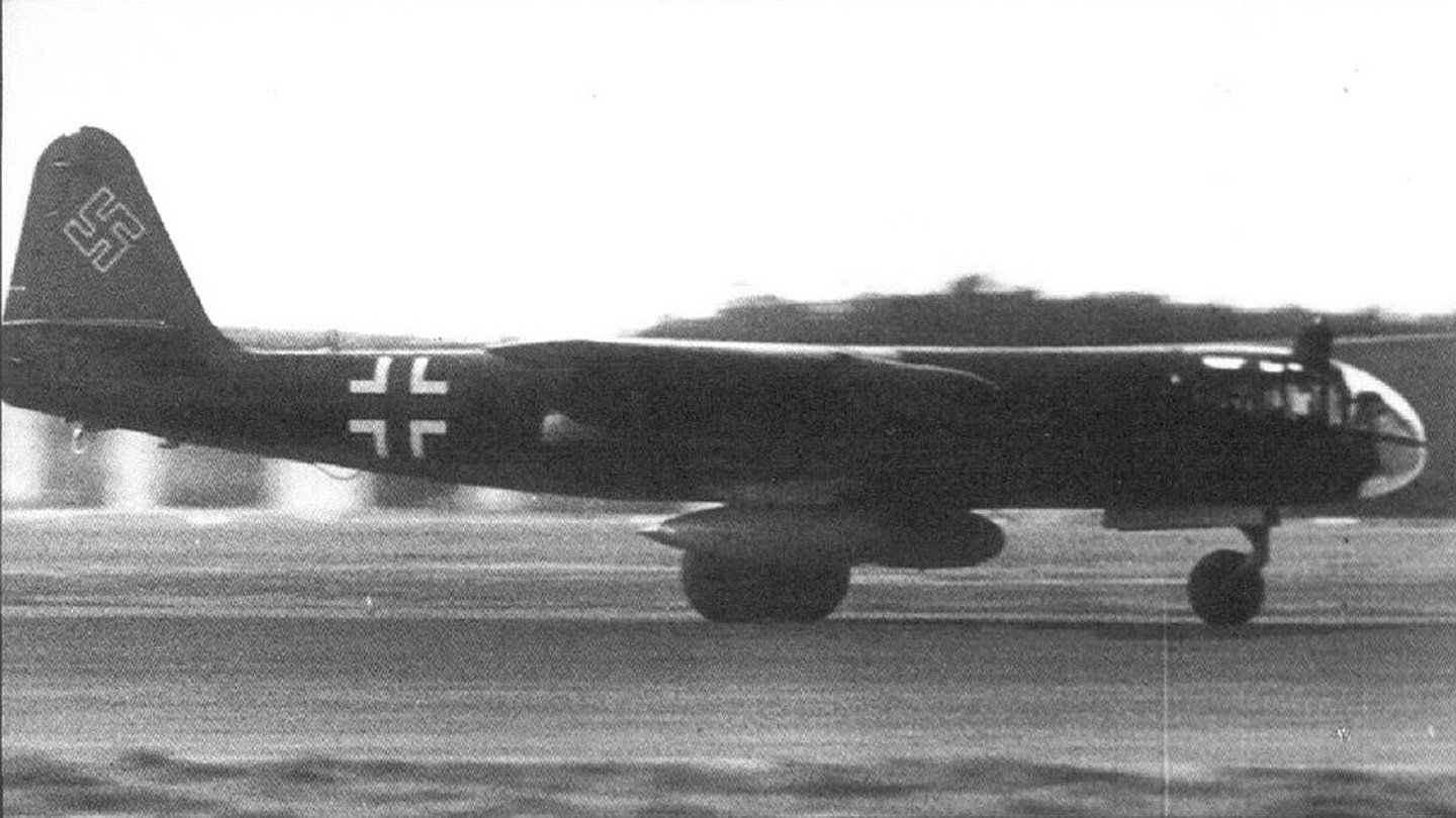 Black-and-white side view of a military Arado Ar 234 jet bomber taxiing on a runway, German Luftwaffe markings visible.