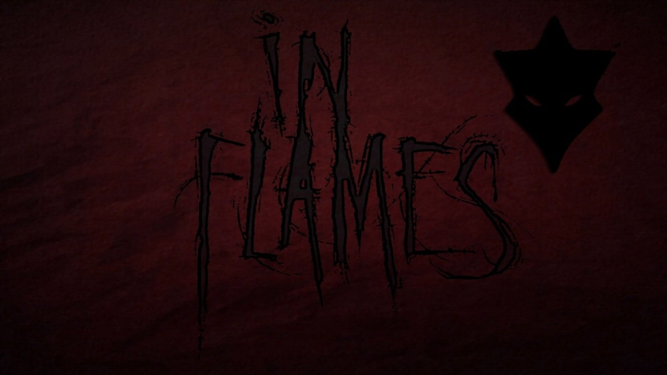 Dark red background with the band name In Flames written in a jagged, eerie font, accompanied by a black, abstract star-like symbol.