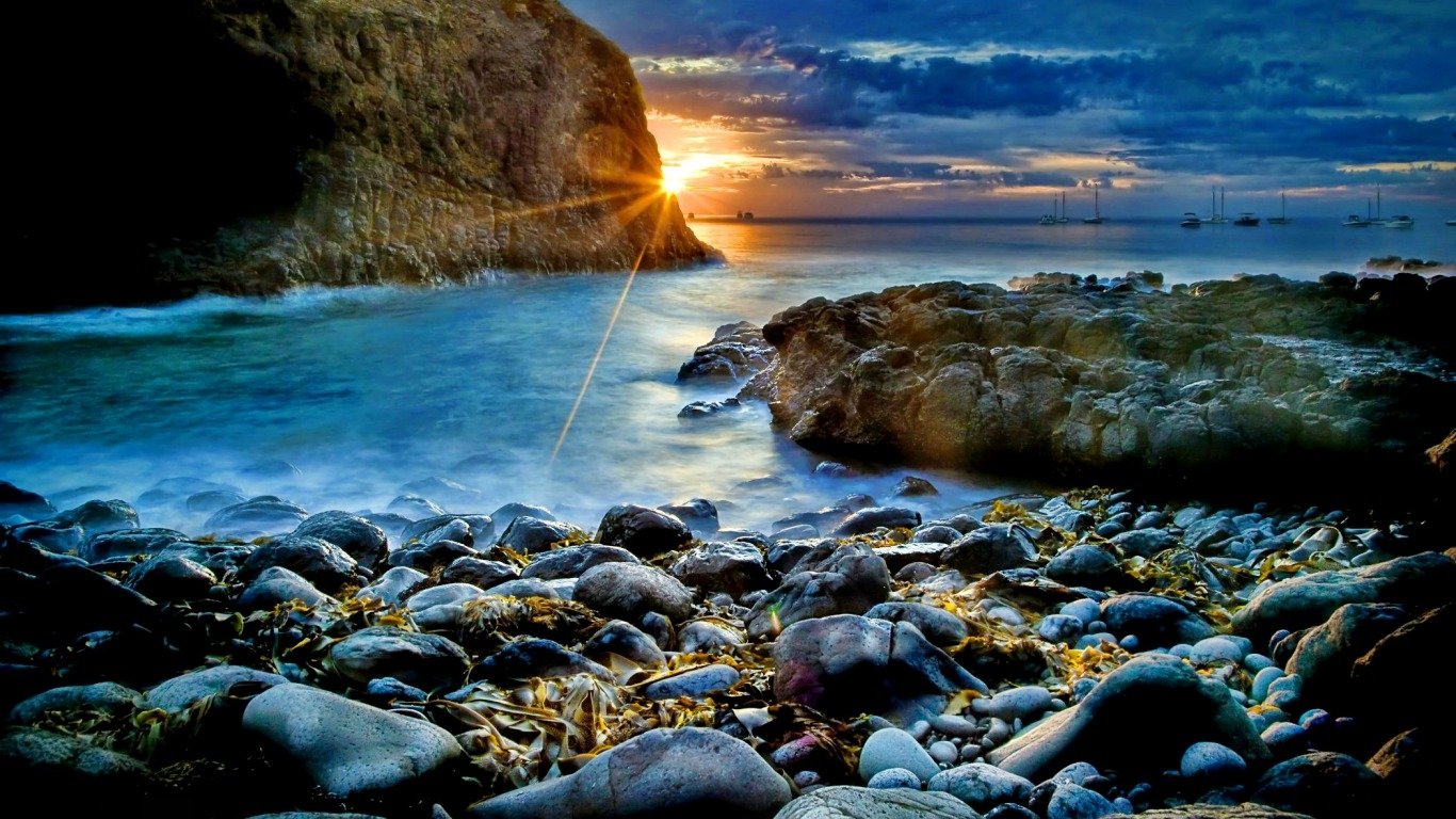 Sunset Serenity Over Ocean Rocks