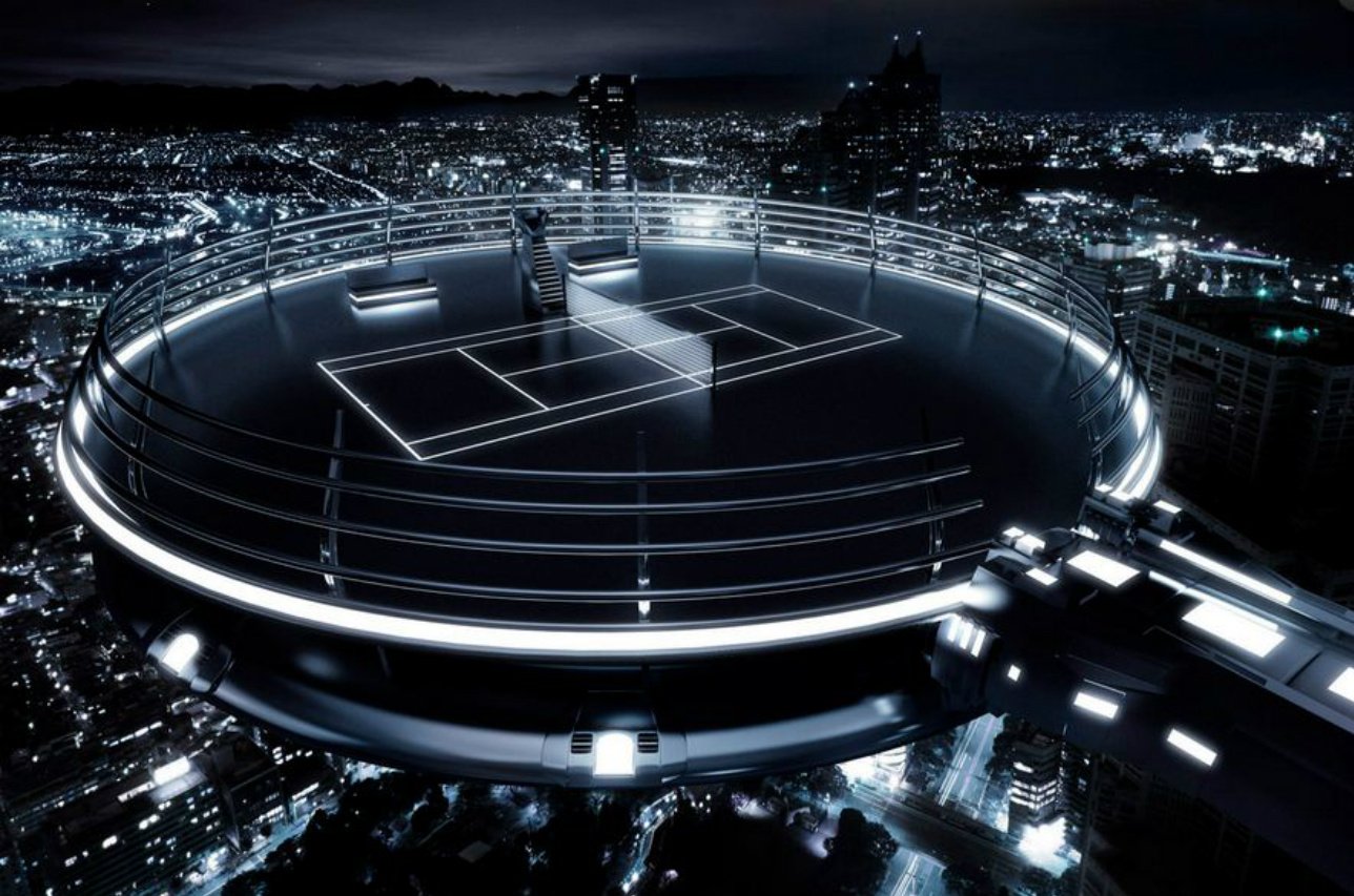 A futuristic, circular rooftop tennis court illuminated at night above a cityscape, blending sports with advanced architectural design.