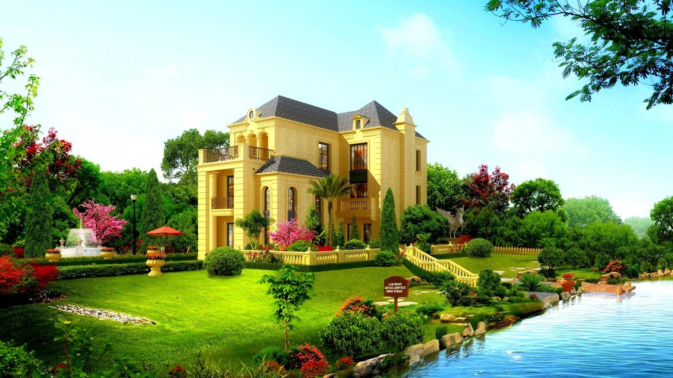A stunning mansion surrounded by lush greenery and colorful flowers, featuring a serene water view, showcasing exquisite man-made architecture.