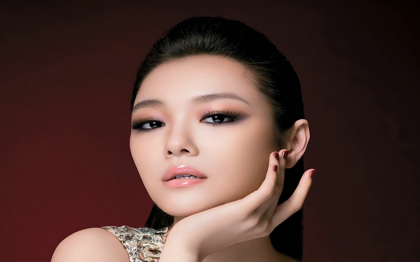 A glamorous portrait of Taiwanese-Korean celebrity Barbie Hsu, showcasing her striking features and elegant pose with a sophisticated beauty look.