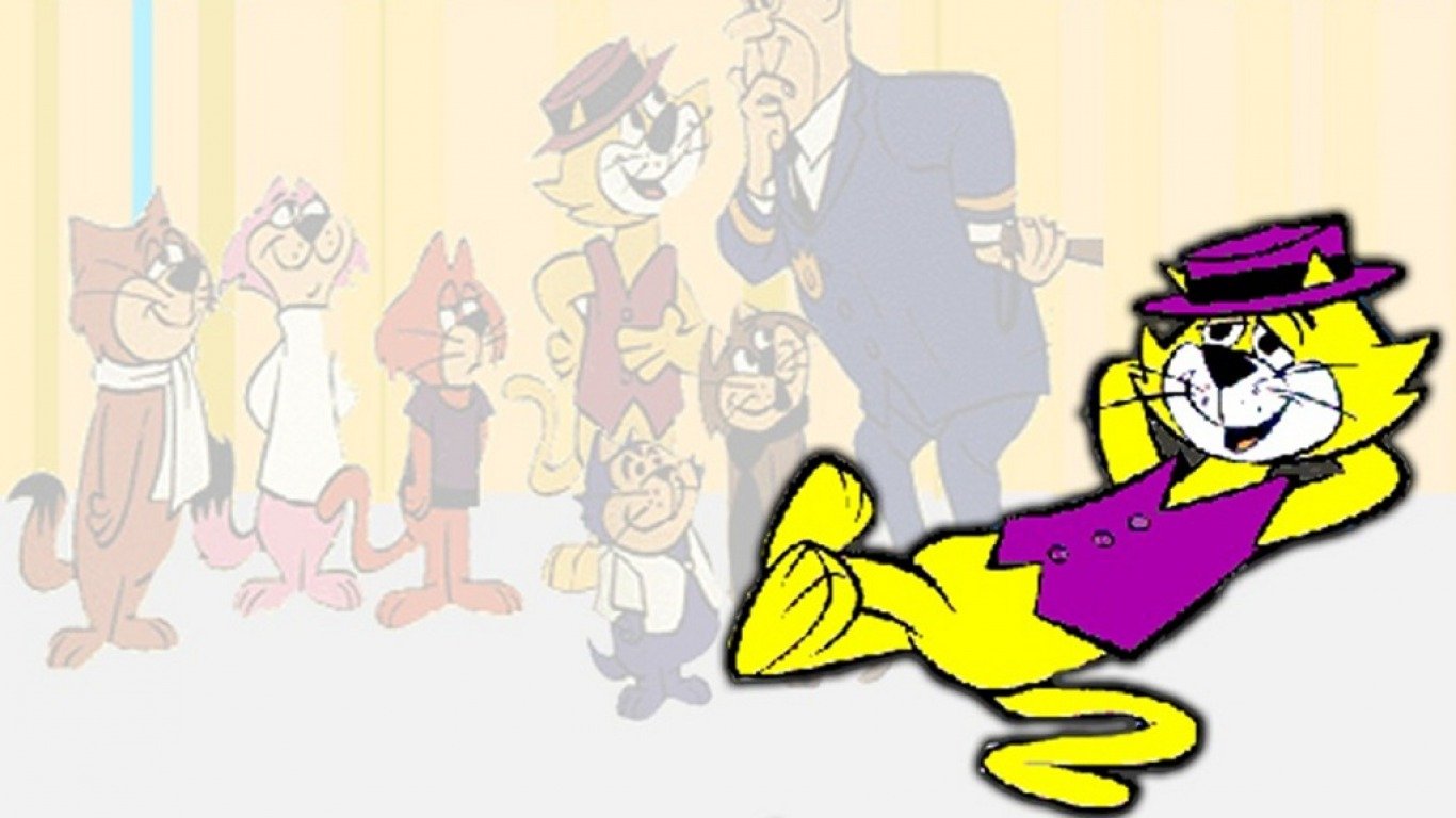 A vibrant image from the TV show Top Cat featuring the relaxed yellow cat in a purple vest and hat prominently in front, with other characters and a man in the background.