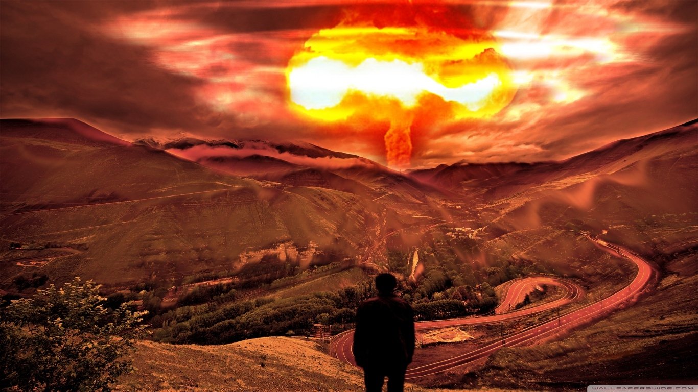 A solitary figure stands on a hillside, gazing at a dramatic explosion in the distance, with vibrant orange and red clouds rising over a mountainous landscape, highlighting a military theme.
