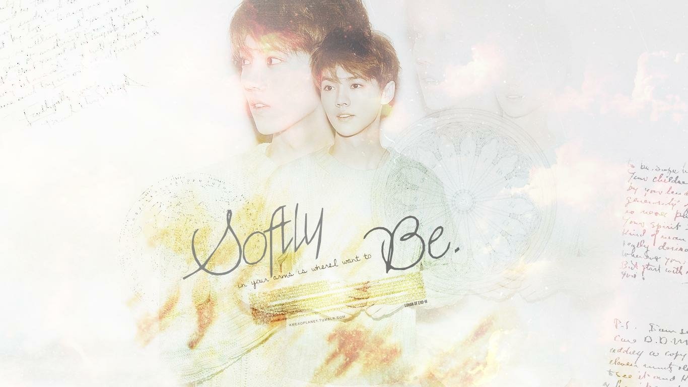 A dreamy image featuring a member of EXO with ethereal backgrounds and soft text overlay that reads Softly Be. The artwork captures a gentle musical vibe.