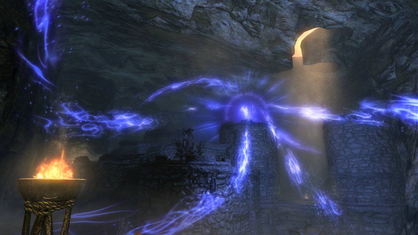 Screenshot from The Elder Scrolls V: Skyrim: a purple magical vortex swirls inside a dim cave near a brazier and a shaft of sunlight.