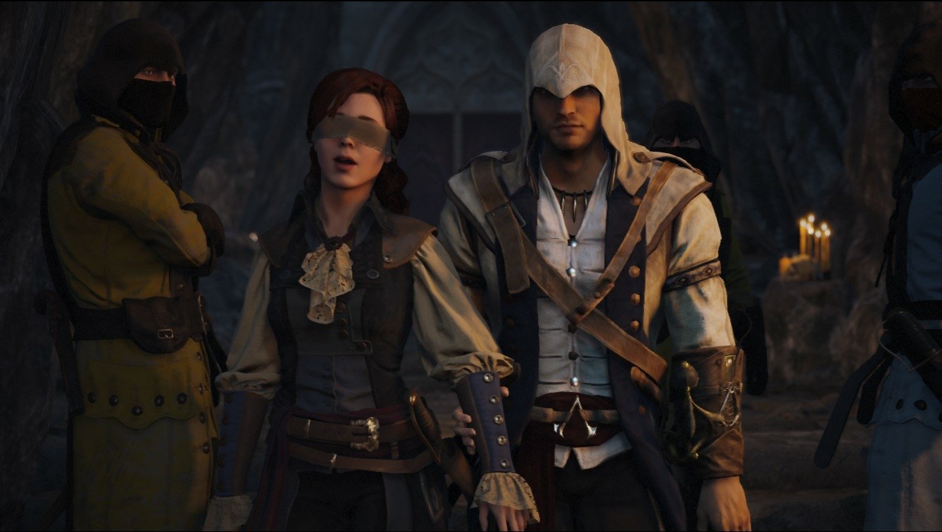 Characters from the video game Assassin's Creed: Unity stand together in a dimly lit, cave-like setting, showcasing detailed historical costumes and somber expressions.
