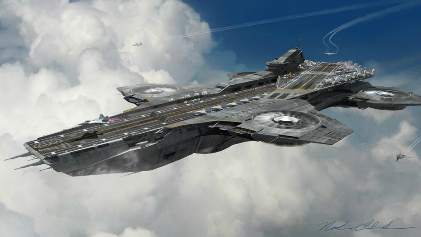 The helicarrier from the TV show Agents of S.H.I.E.L.D. flies above the clouds with helicopters hovering nearby.