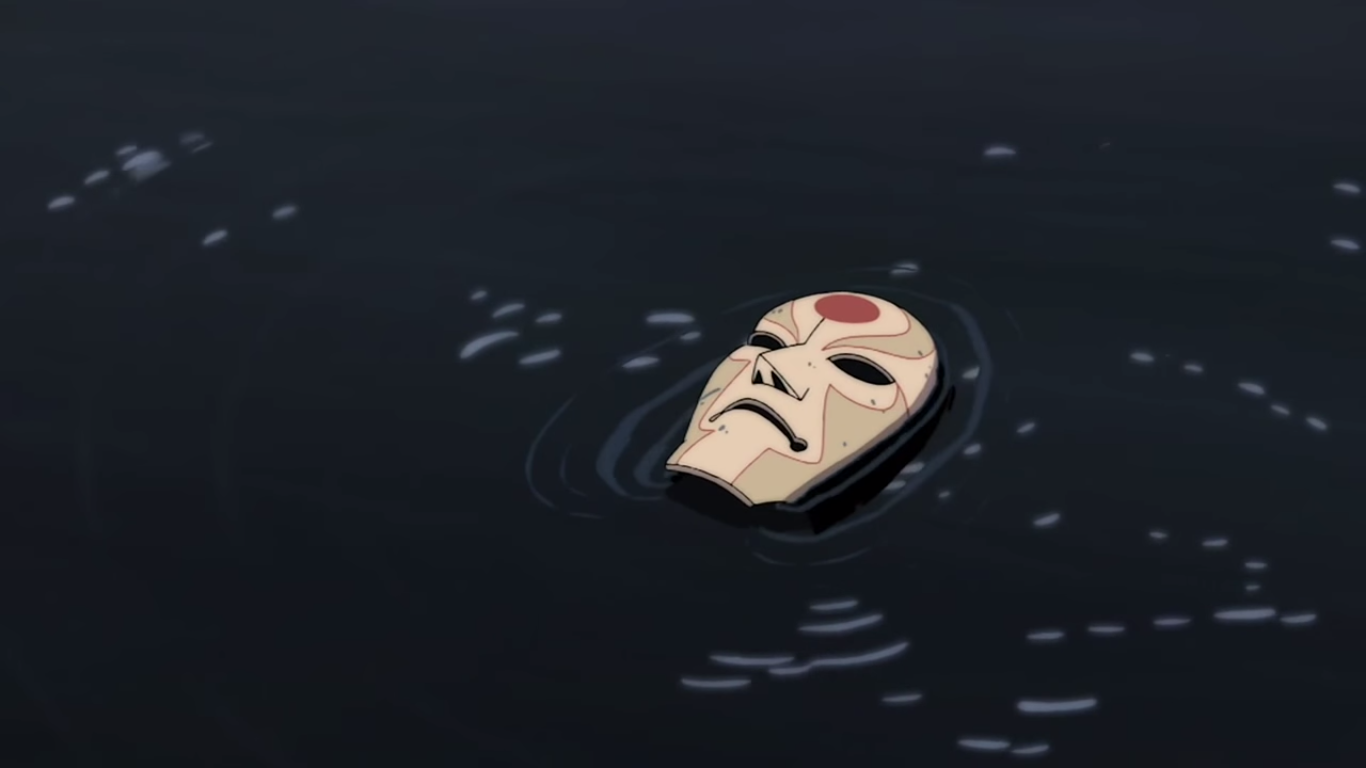 A close-up of a mask floating on dark water from the anime Avatar: The Legend of Korra.