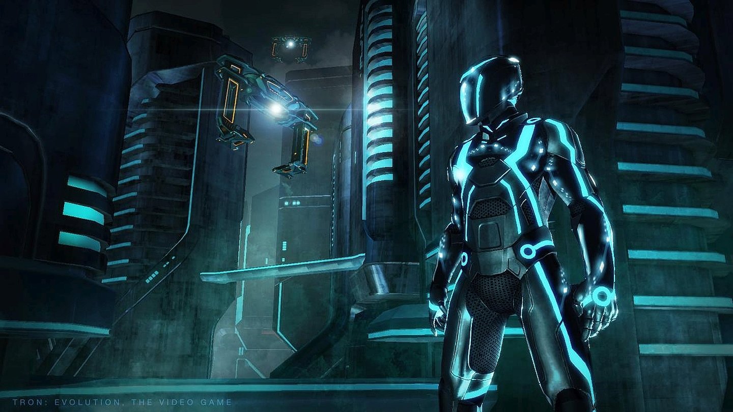 A glowing, futuristic character stands in a neon-lit cityscape from the video game Tron: Evolution.