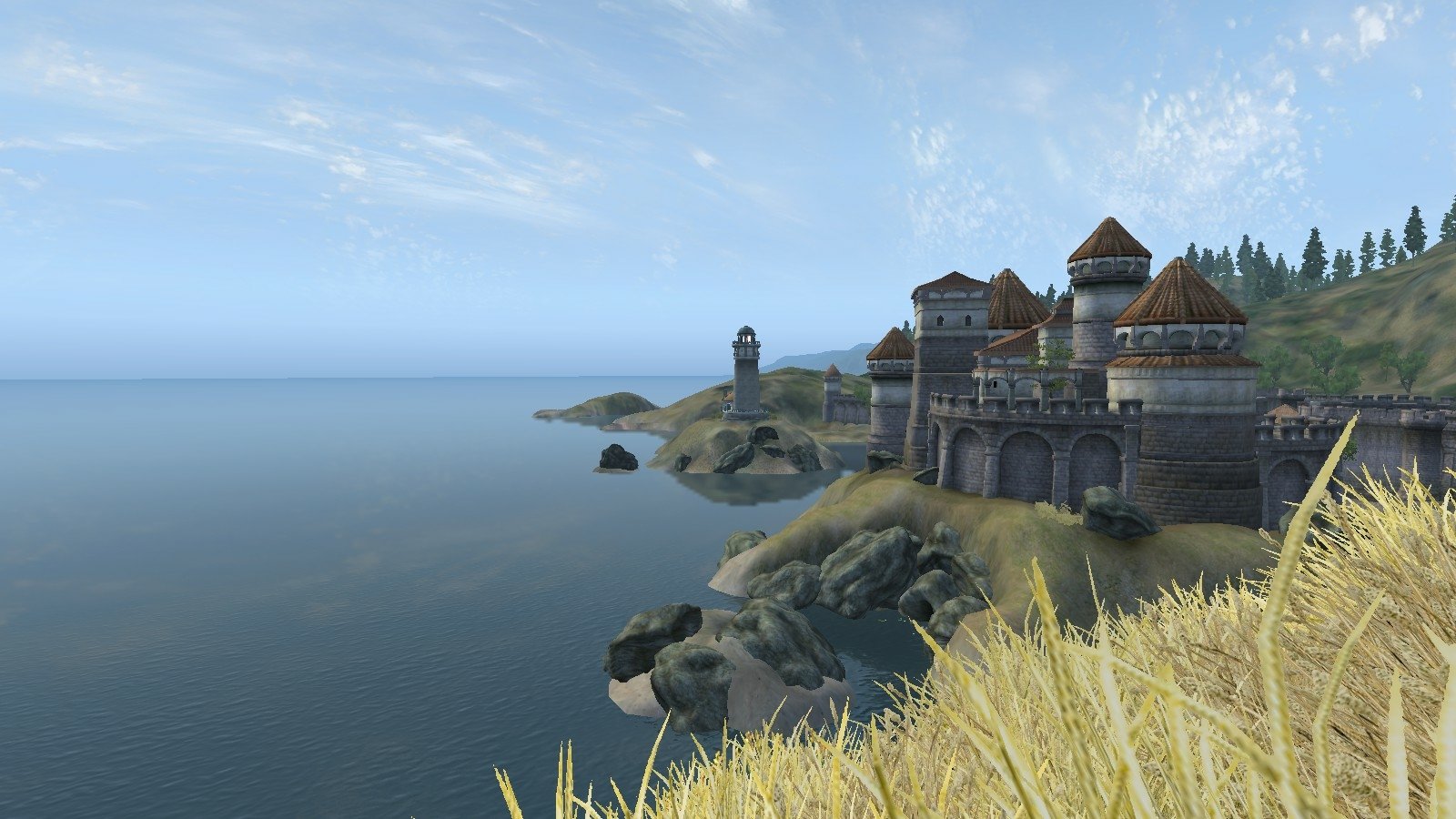 Scenic coastal view from The Elder Scrolls IV: Oblivion featuring a large fortress atop rocky cliffs overlooking a calm sea under a clear sky.
