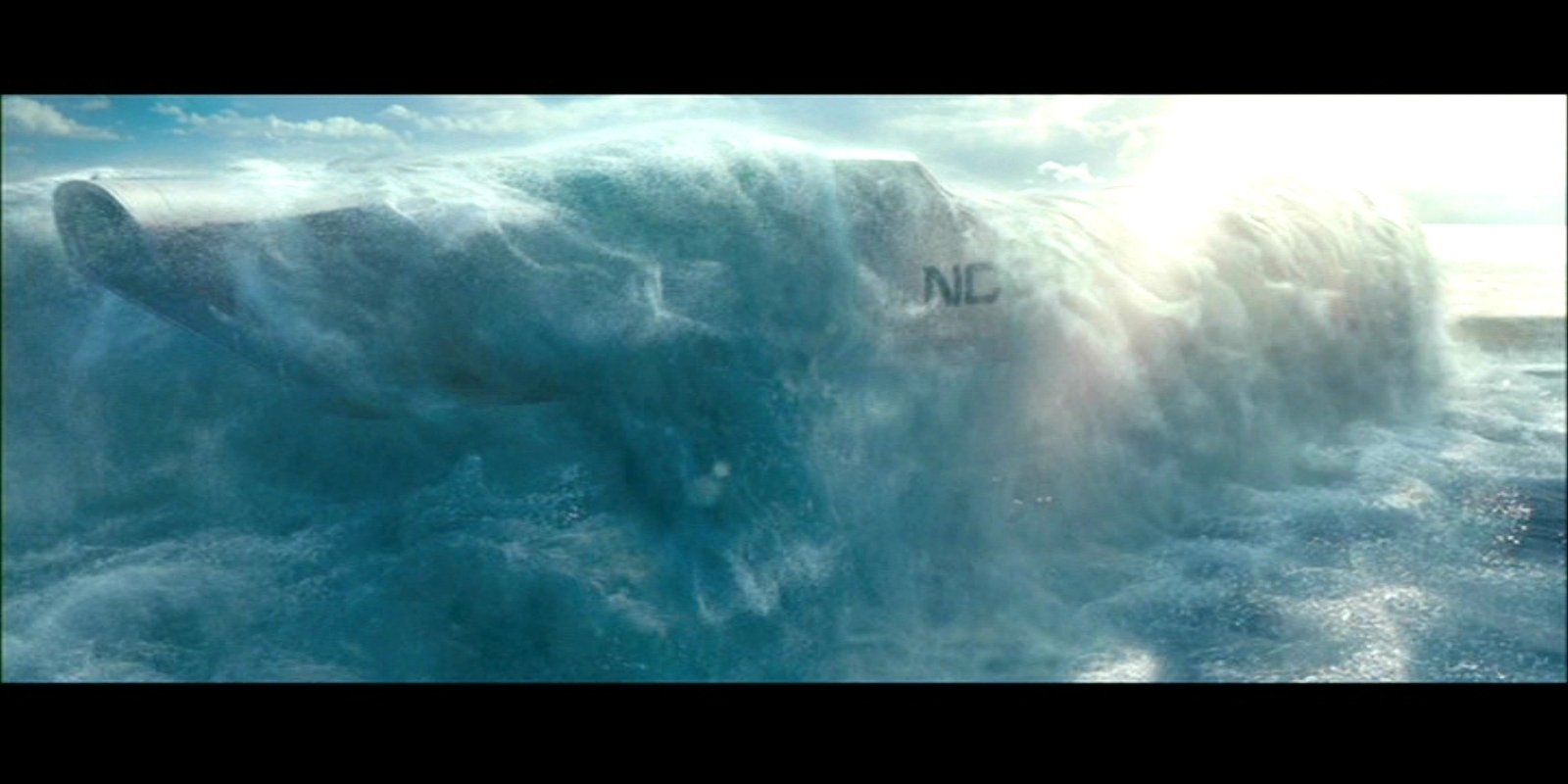 A futuristic submarine partially submerged in turbulent ocean waters, a scene from the movie Star Trek Into Darkness.
