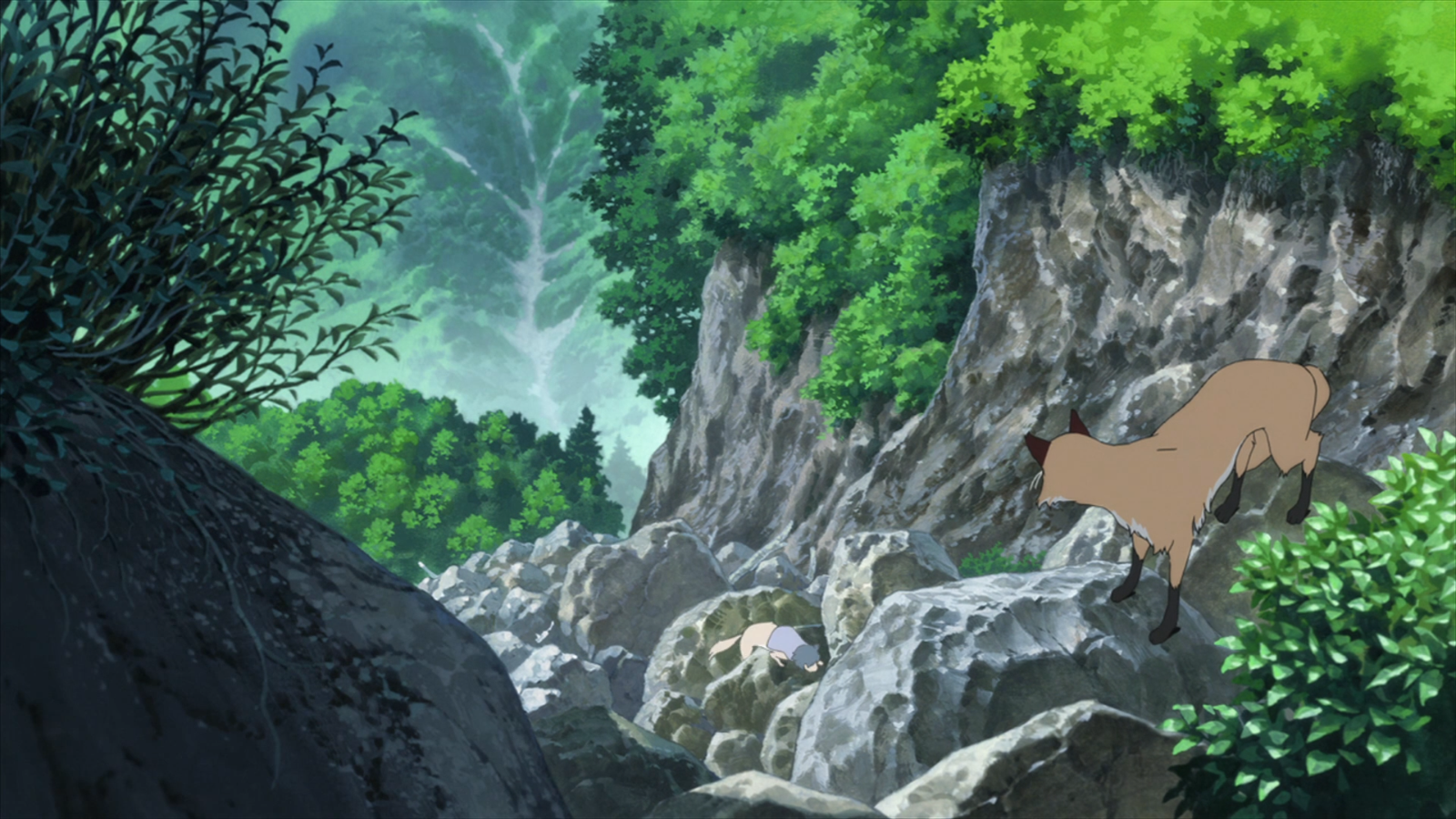 Anime landscape from Wolf Children featuring a fox navigating rocky terrain in a dried riverbed surrounded by lush mountains.