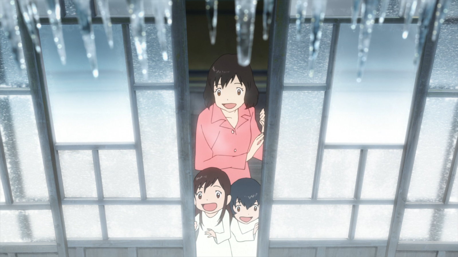 Anime scene from Wolf Children showing Yuki and Ame with their mother indoors during winter, framed by icicles hanging from the roof.