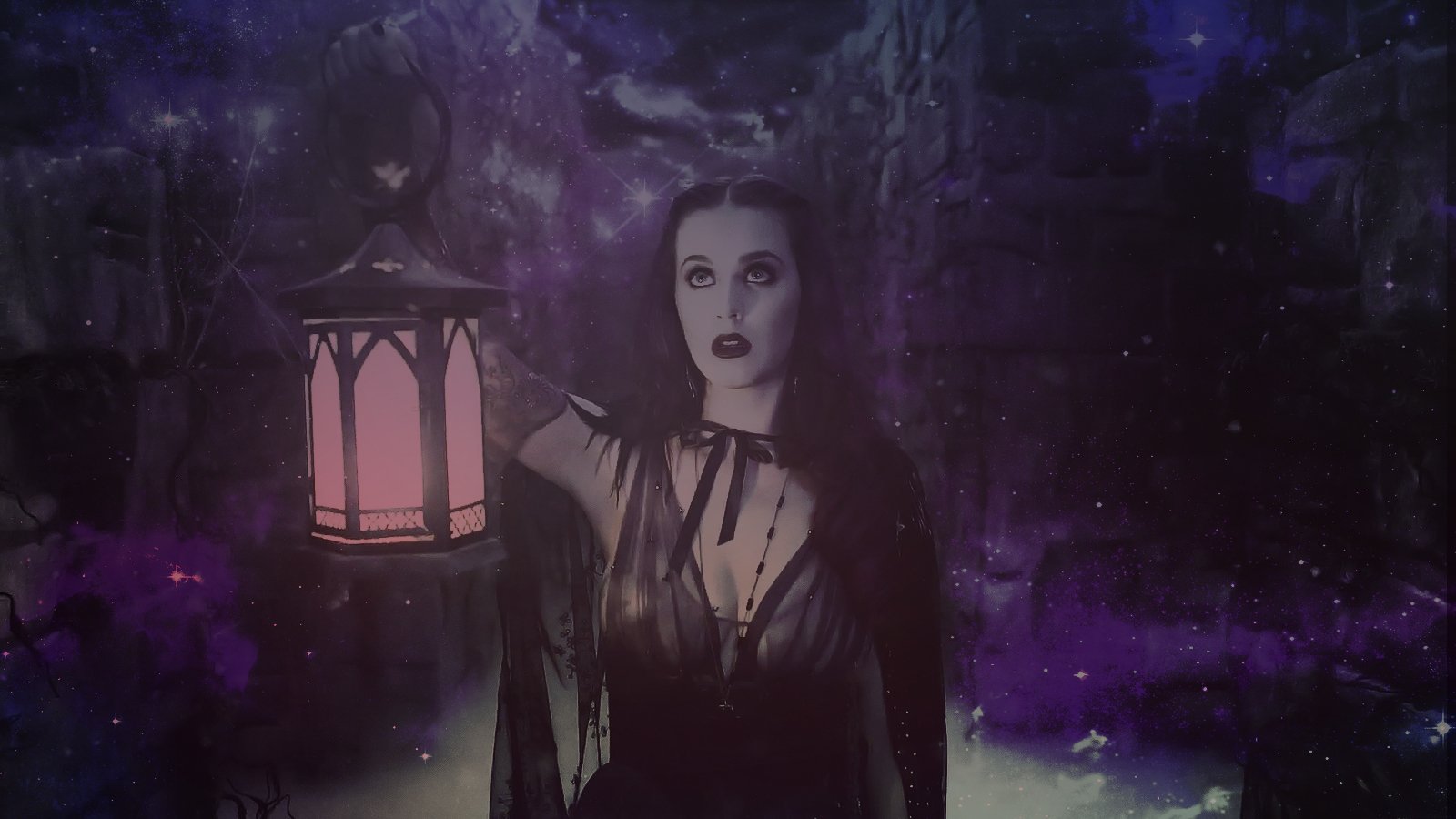 Katy Perry stands in a mystical, dark setting, holding a glowing lantern, surrounded by a starry backdrop that adds an enchanting ambiance to the scene.