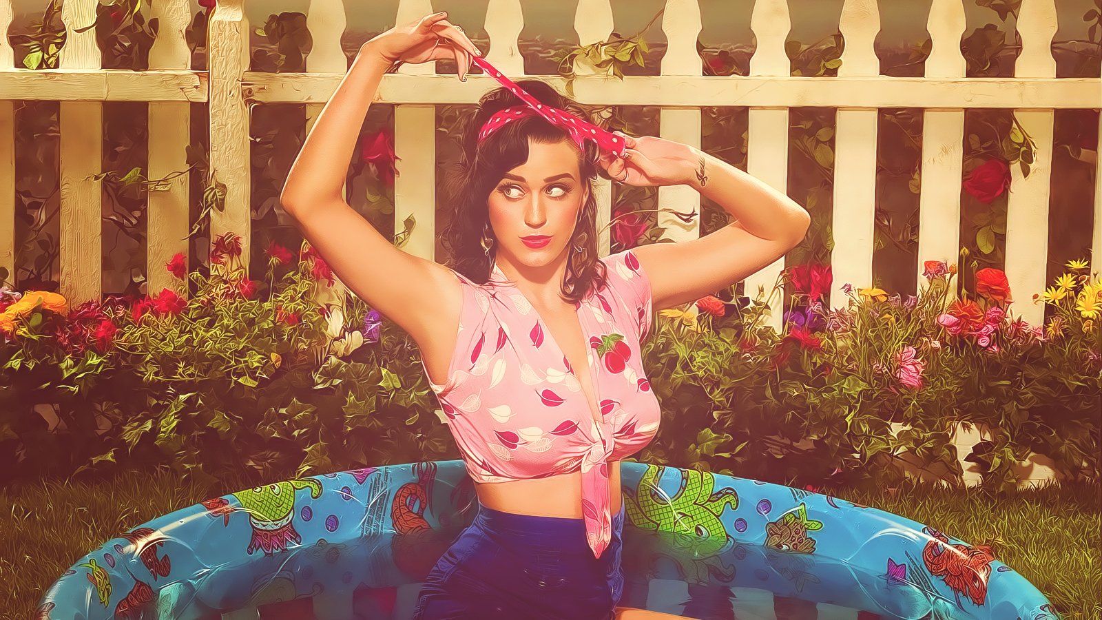 Katy Perry stands in a small kiddie pool, tying a pink headscarf, surrounded by colorful flowers and a white picket fence in a music-themed setting.