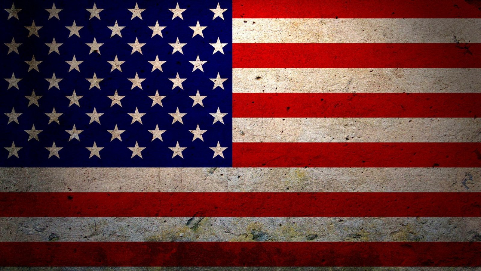 An image of the American flag, showcasing its iconic red and white stripes and blue field with white stars, representing the nation's identity and values.