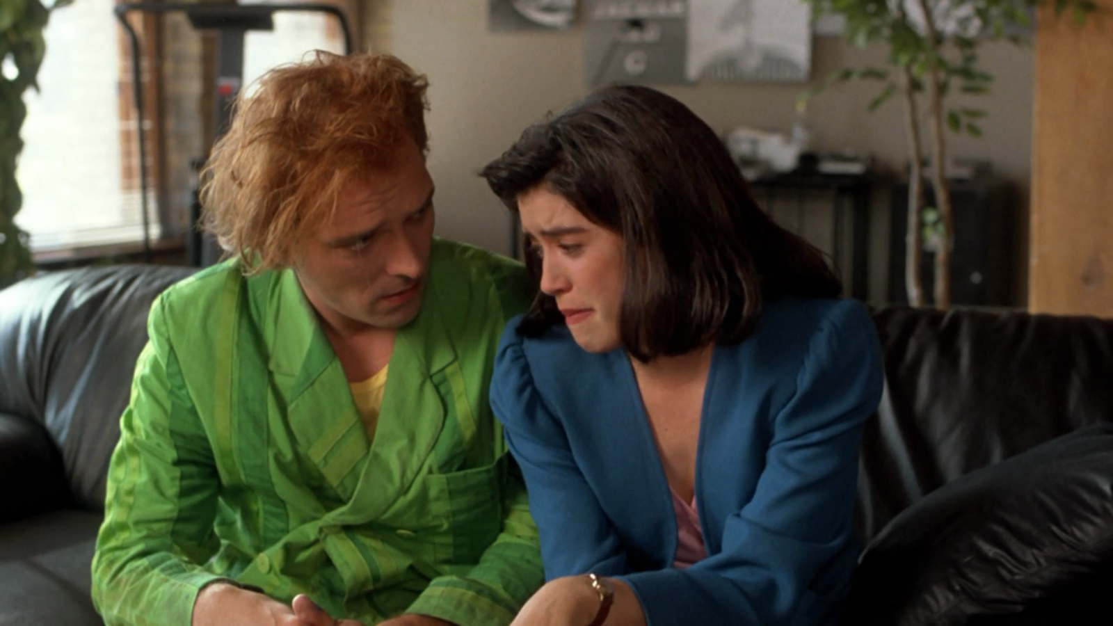 Phoebe Cates and Rik Mayall share an emotional moment in a scene from the movie Drop Dead Fred.