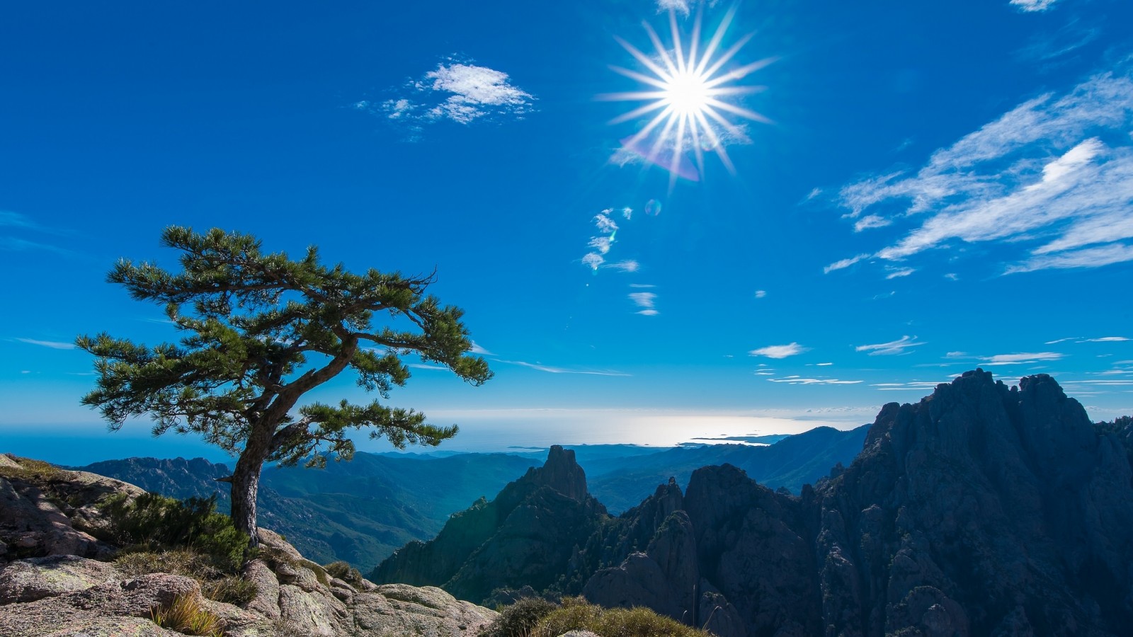 Sun Shining on Mountains in Corsica, France by christophe MELCHERS